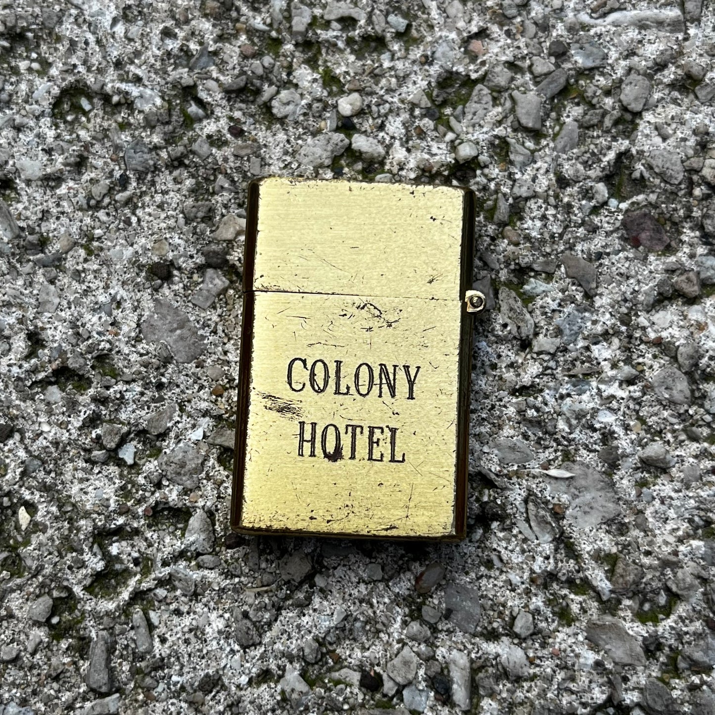 Vintage Brass Colony Hotel flip lighter.