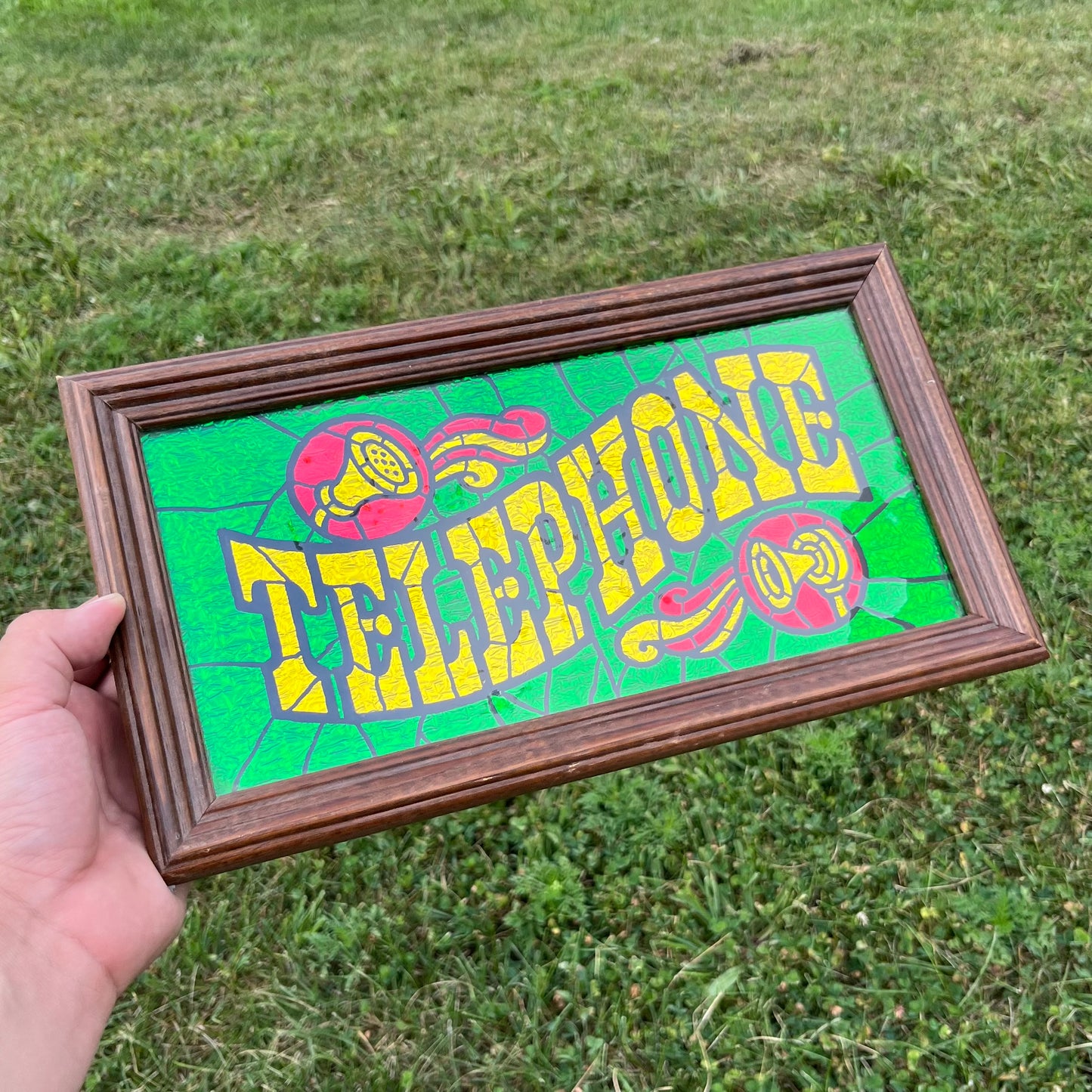 Vintage foil art “Telephone” sign.