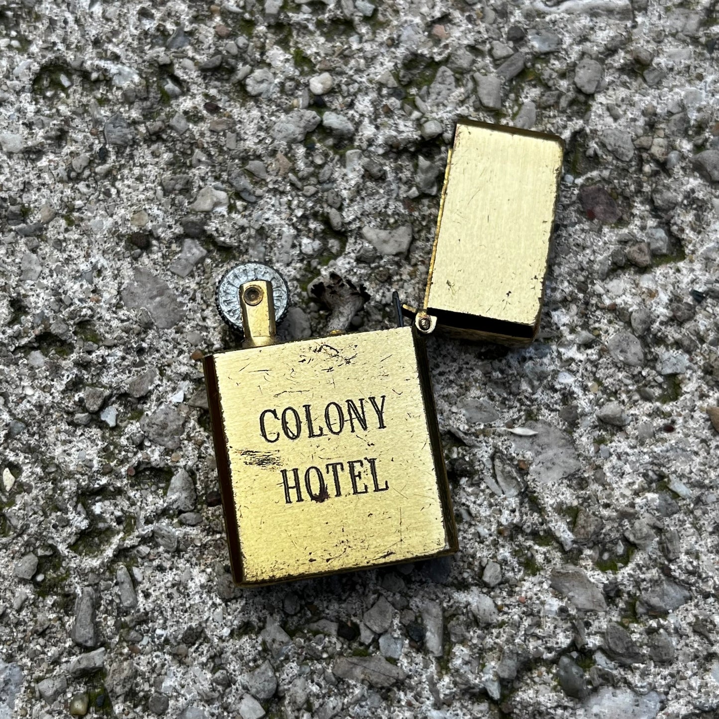 Vintage Brass Colony Hotel flip lighter.