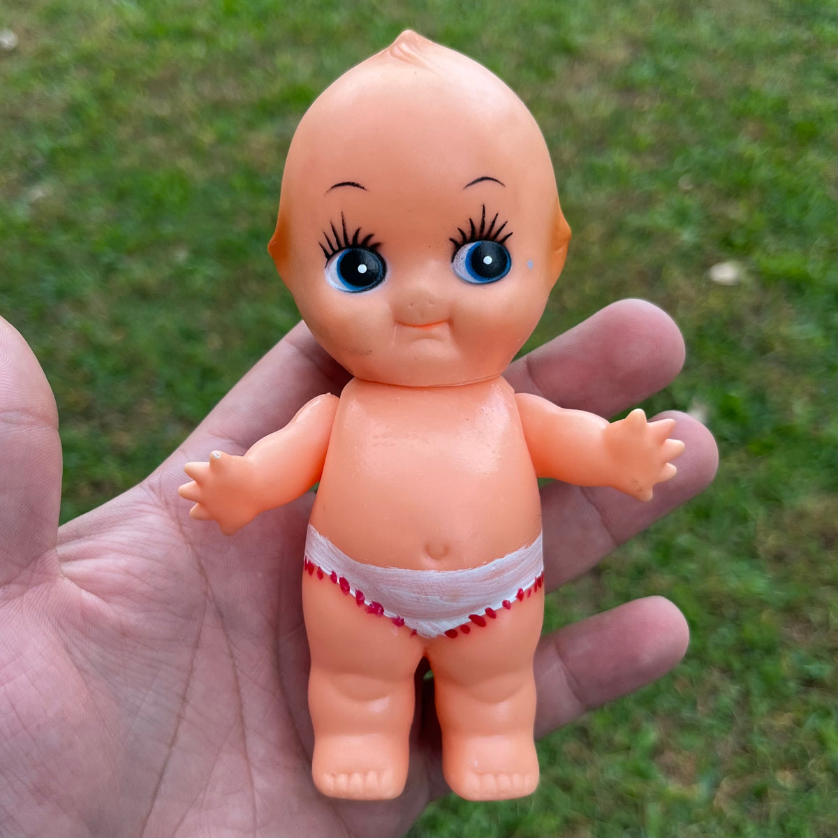 Vintage vinyl Kewpie.