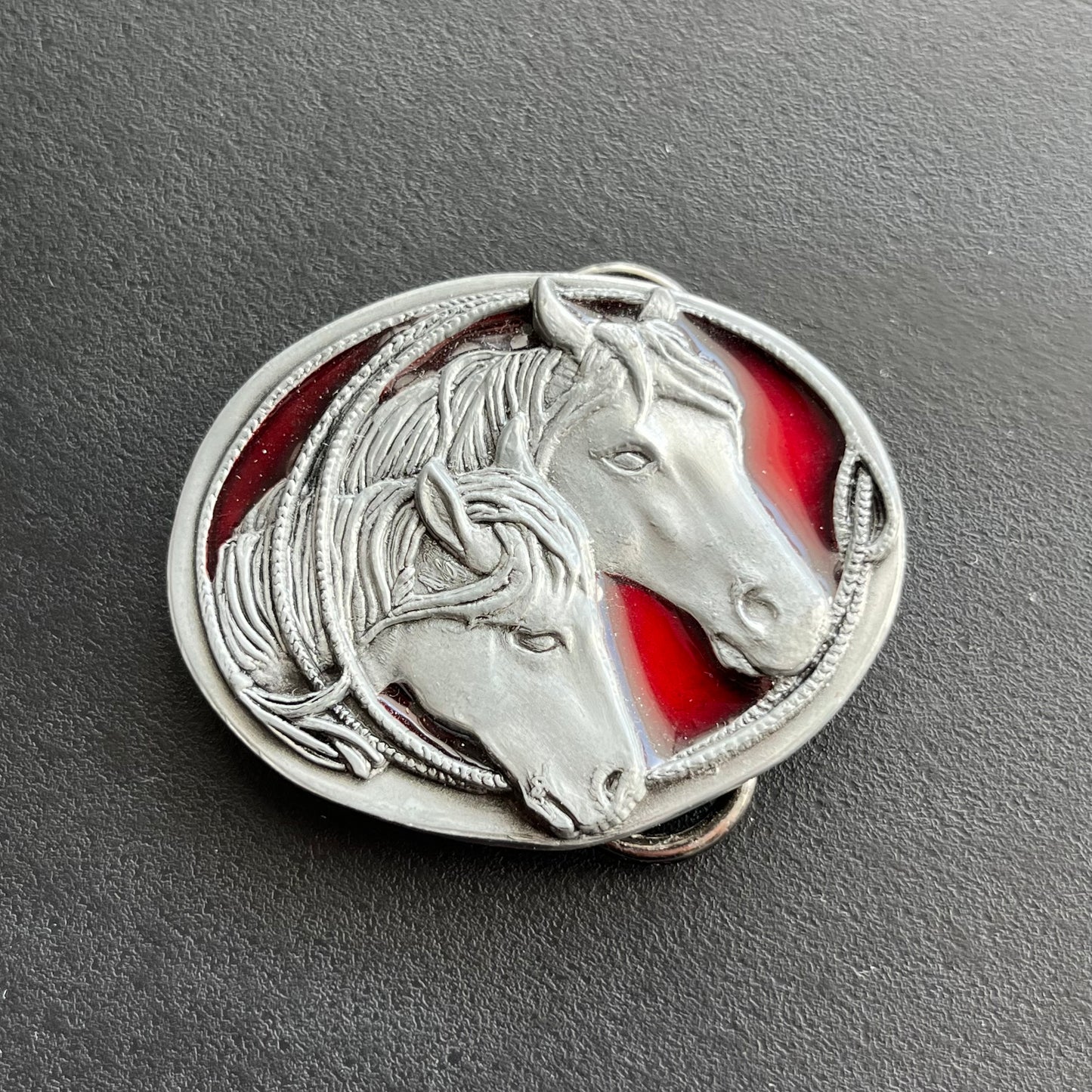 1988 Double horse head belt buckle.