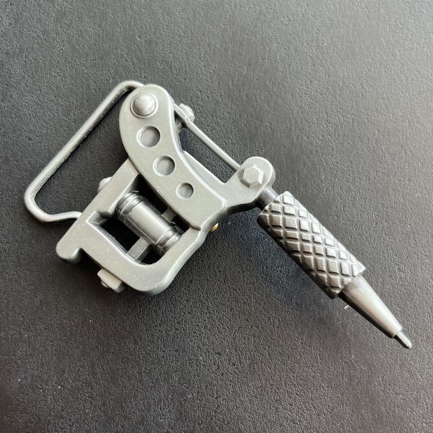 Y2K Tattoo gun belt buckle.