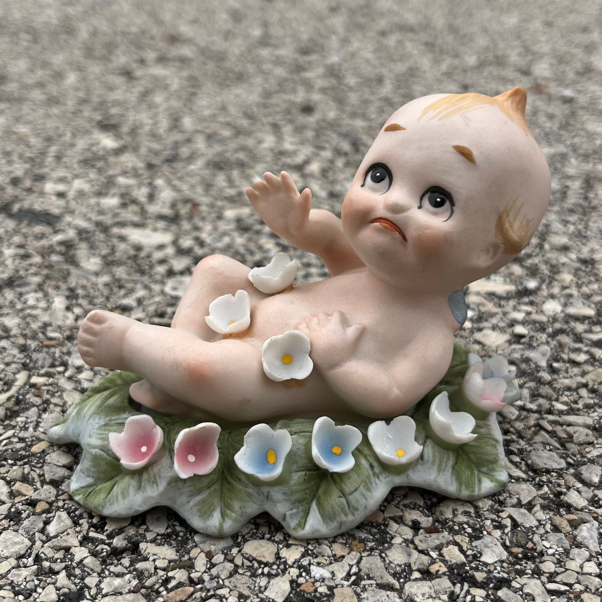 Vintage bisque flower bed Kewpie.