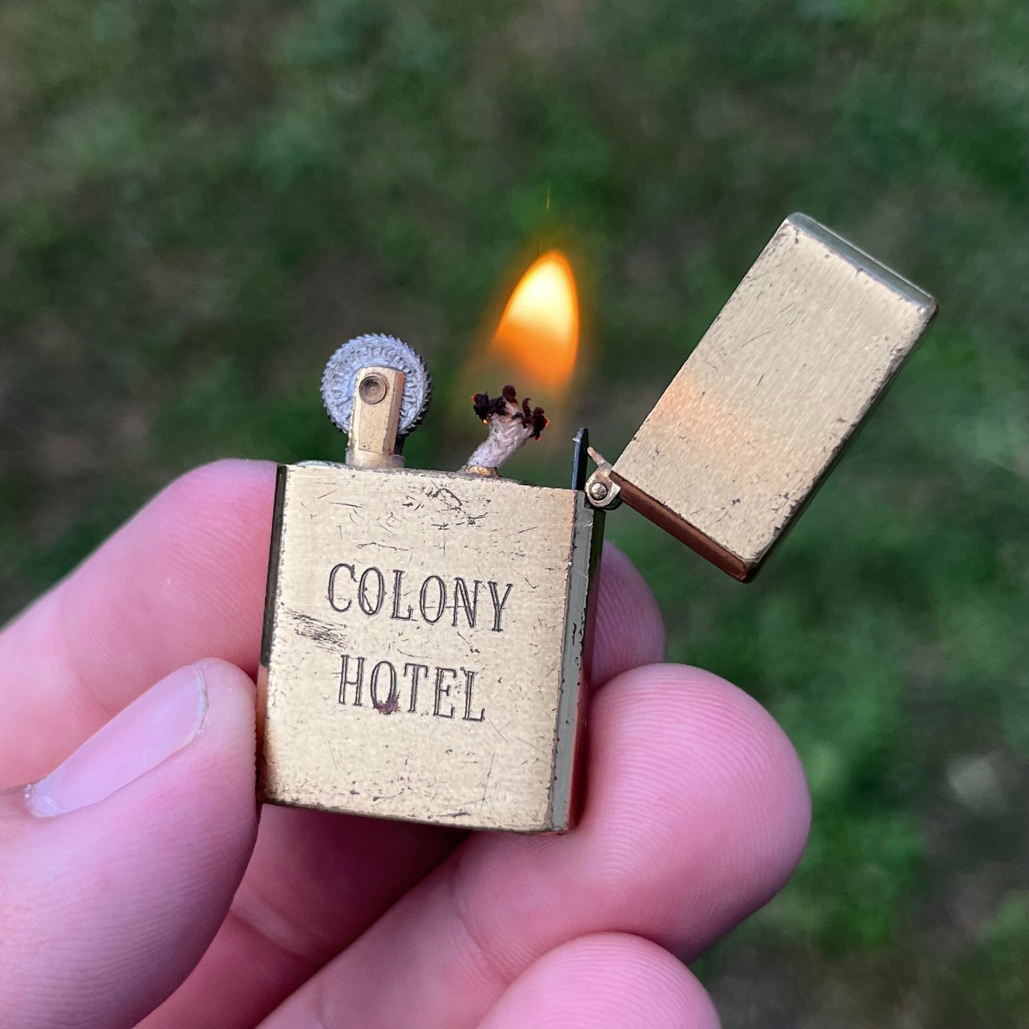 Vintage Brass Colony Hotel flip lighter.