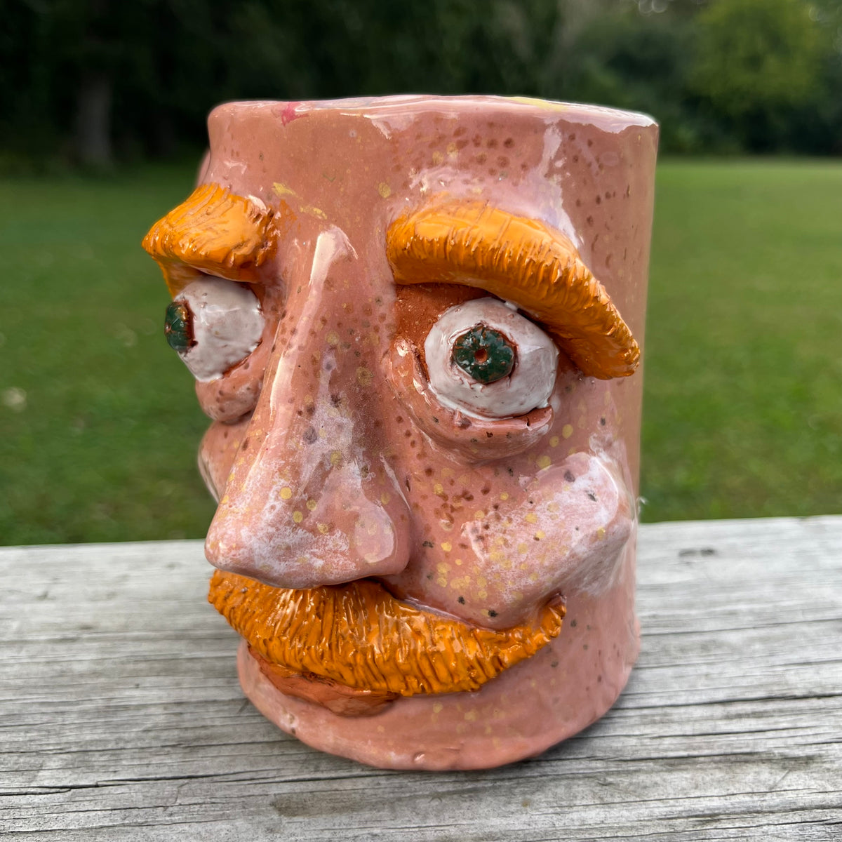 Vintage clay face mug.