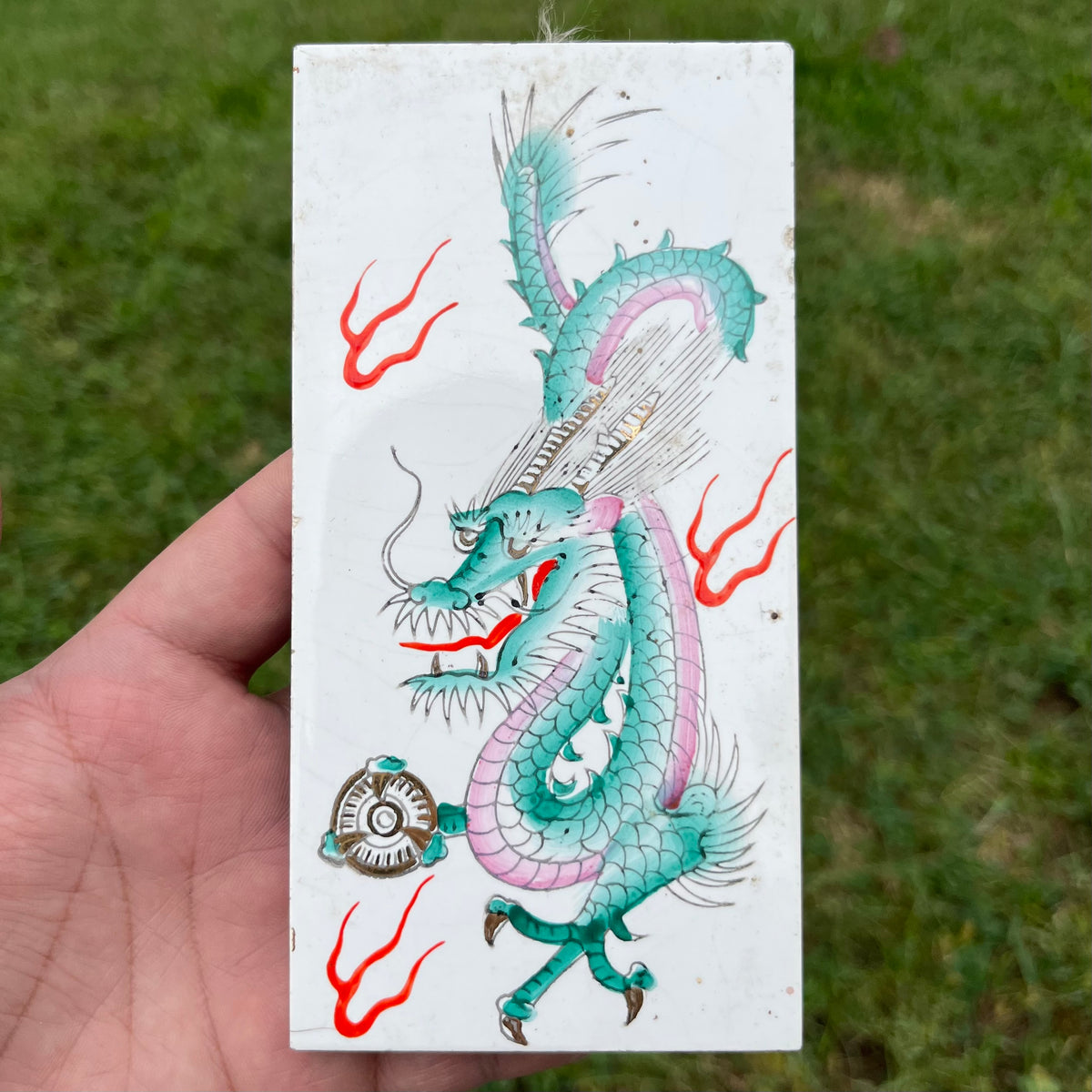 Vintage painted dragon tile.