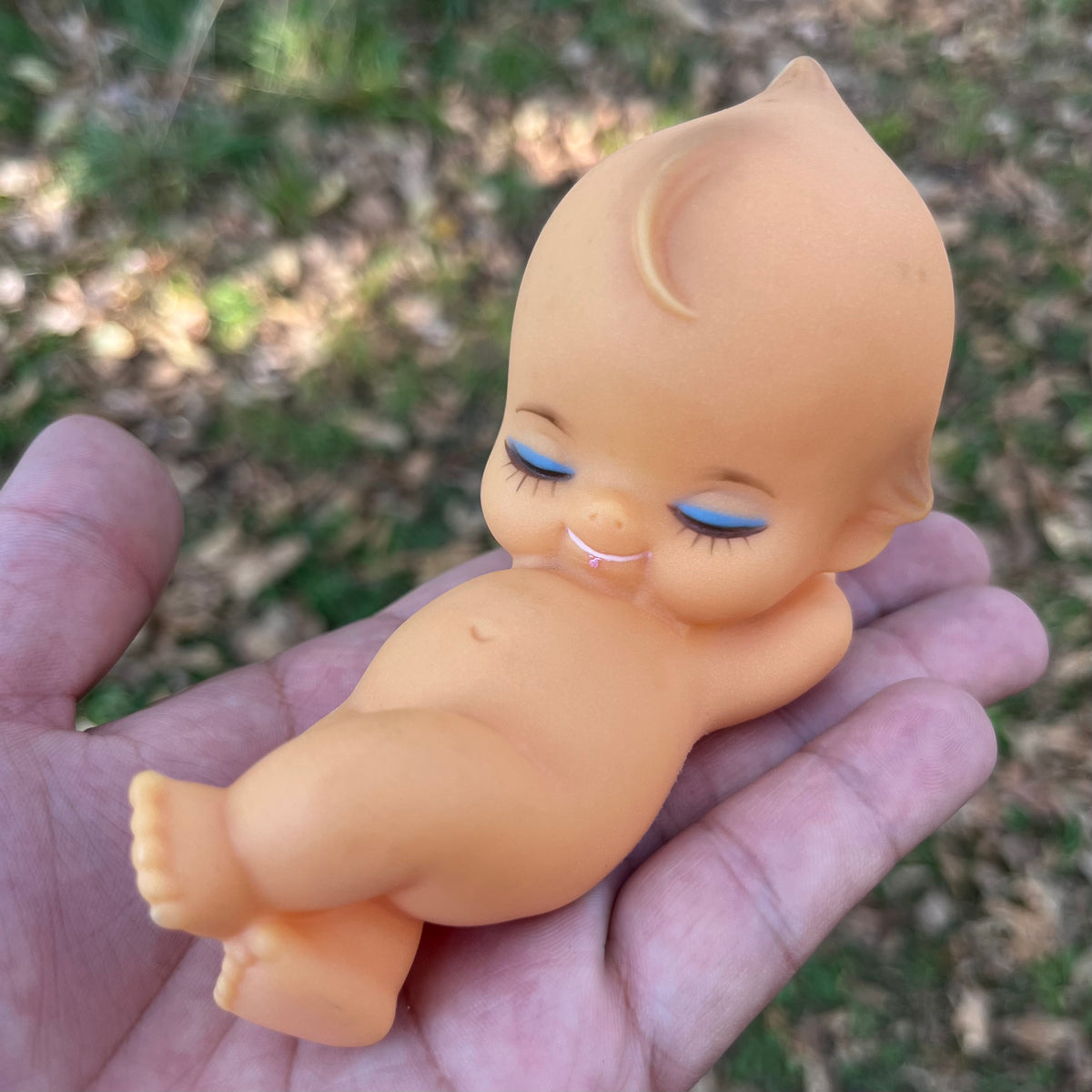 Vintage vinyl sleepy Kewpie.
