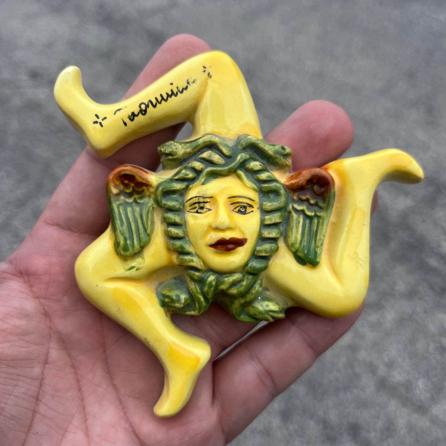 Vintage ceramic Trinakira wall hanging.