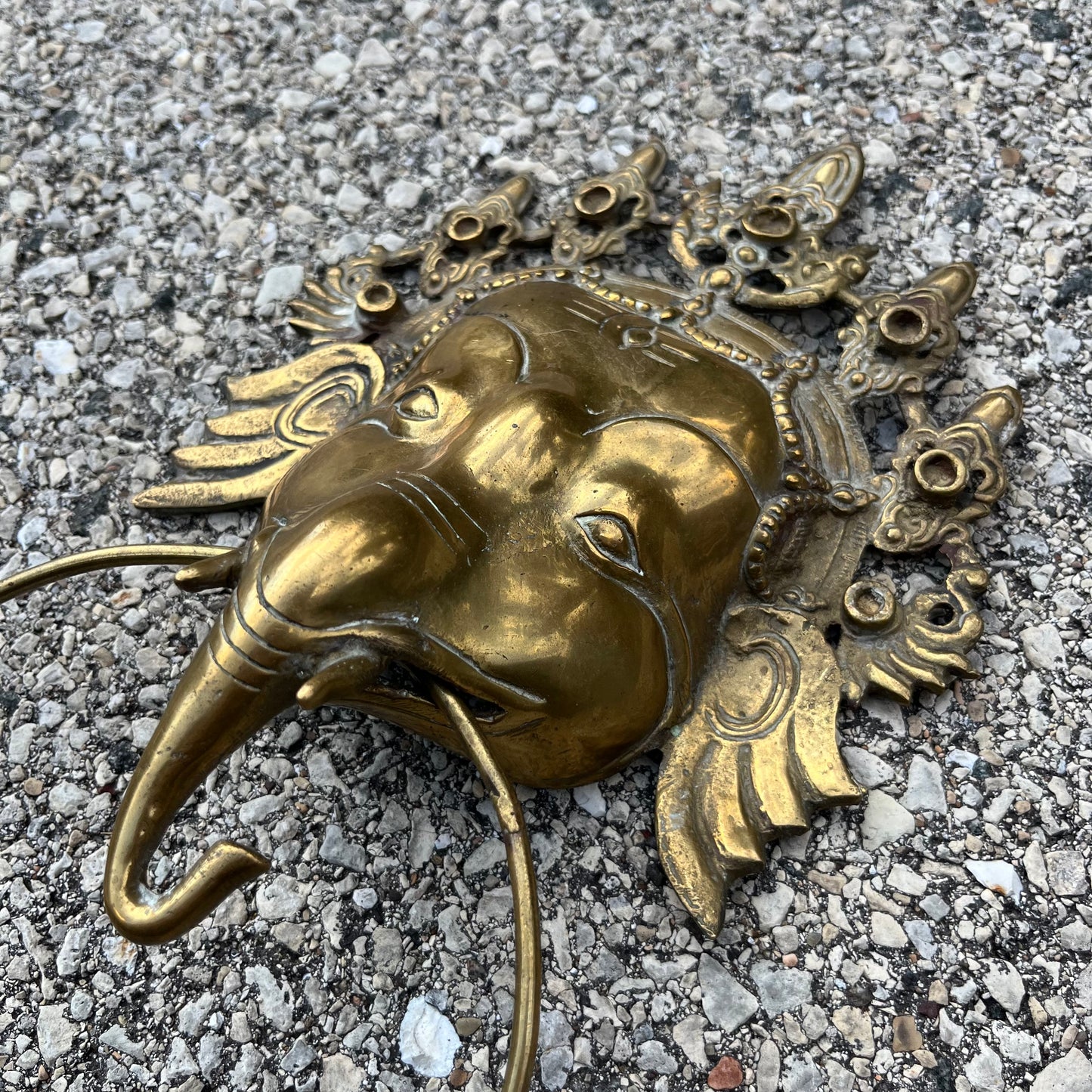 Vintage brass Ganesh cloth holder.