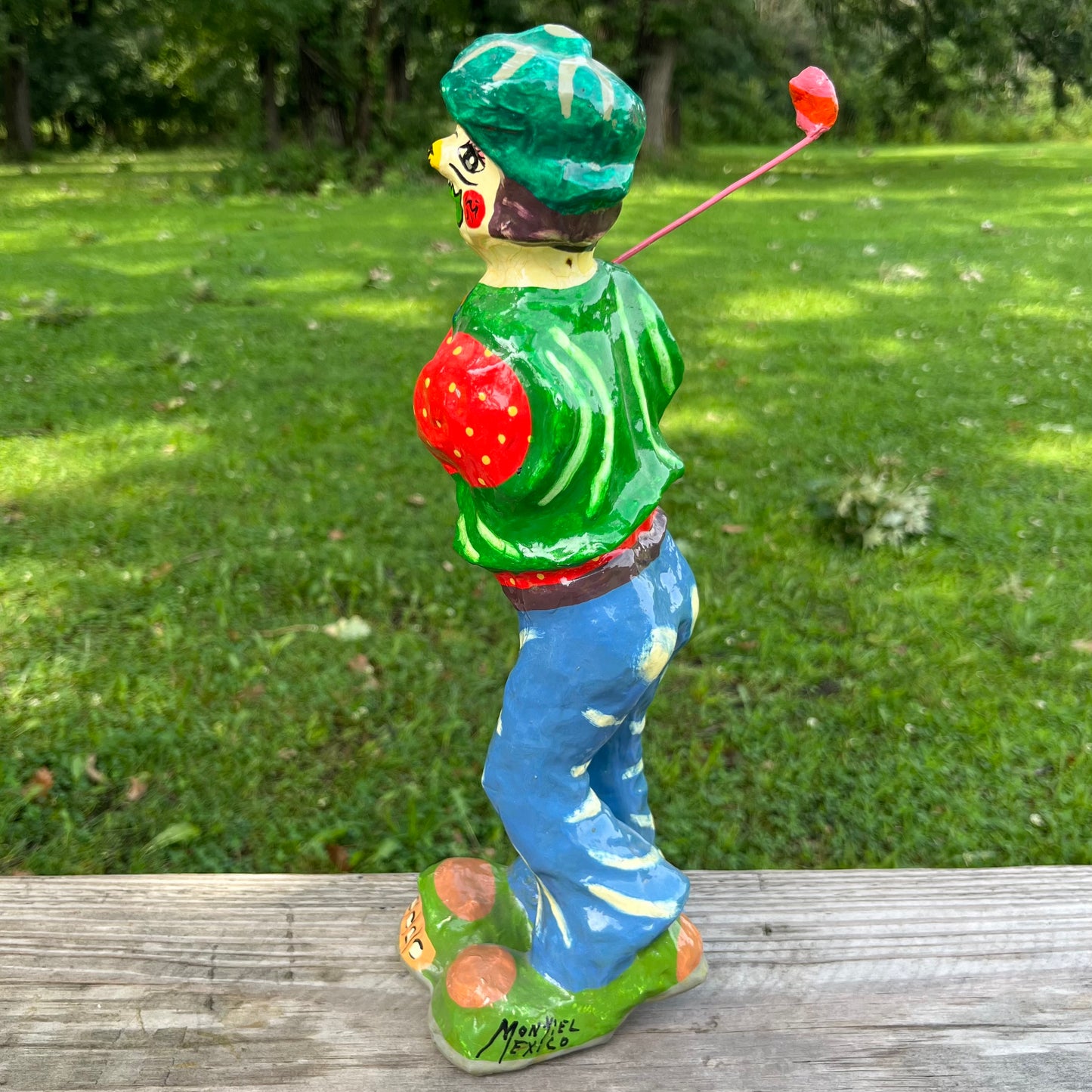 Vintage paper mache golfer clown.