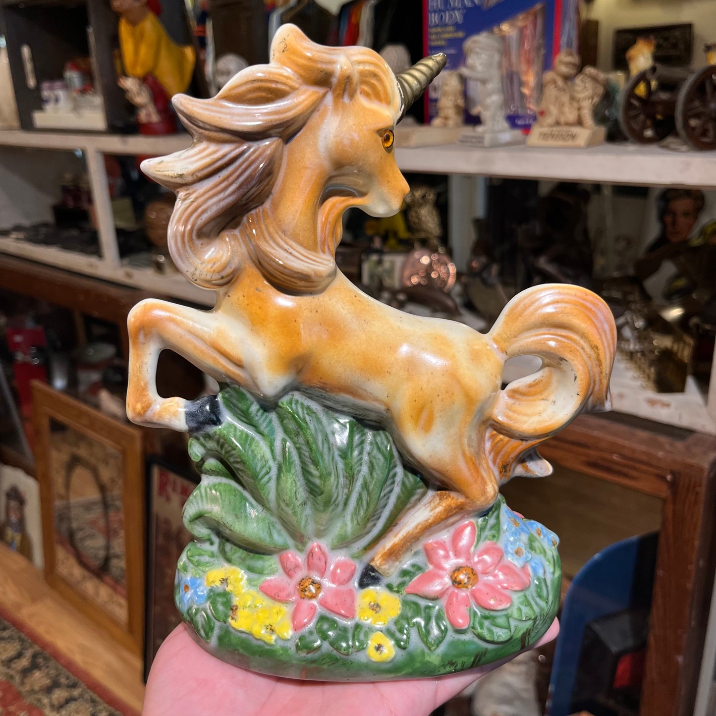 1981 Ceramic unicorn statue.