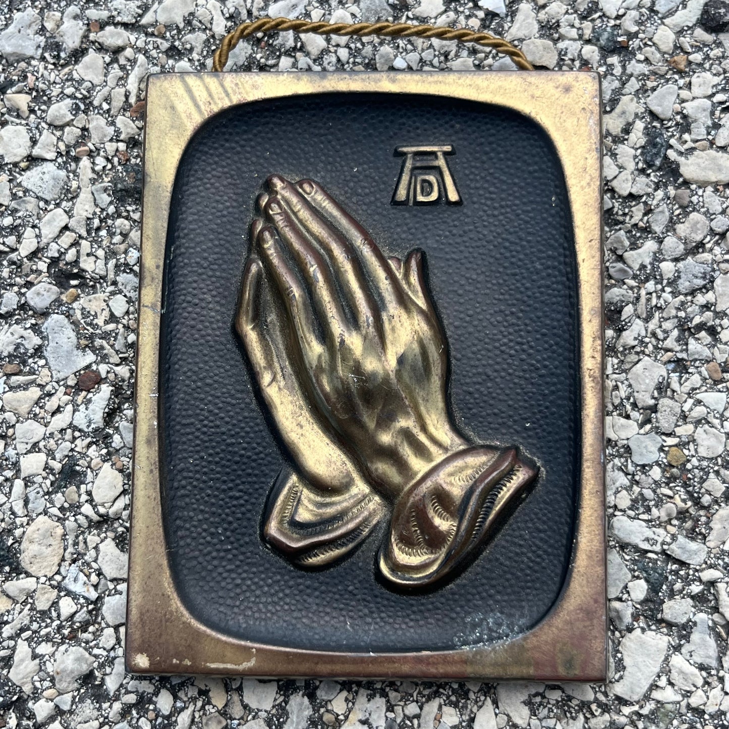 Vintage brass praying hands plaque.