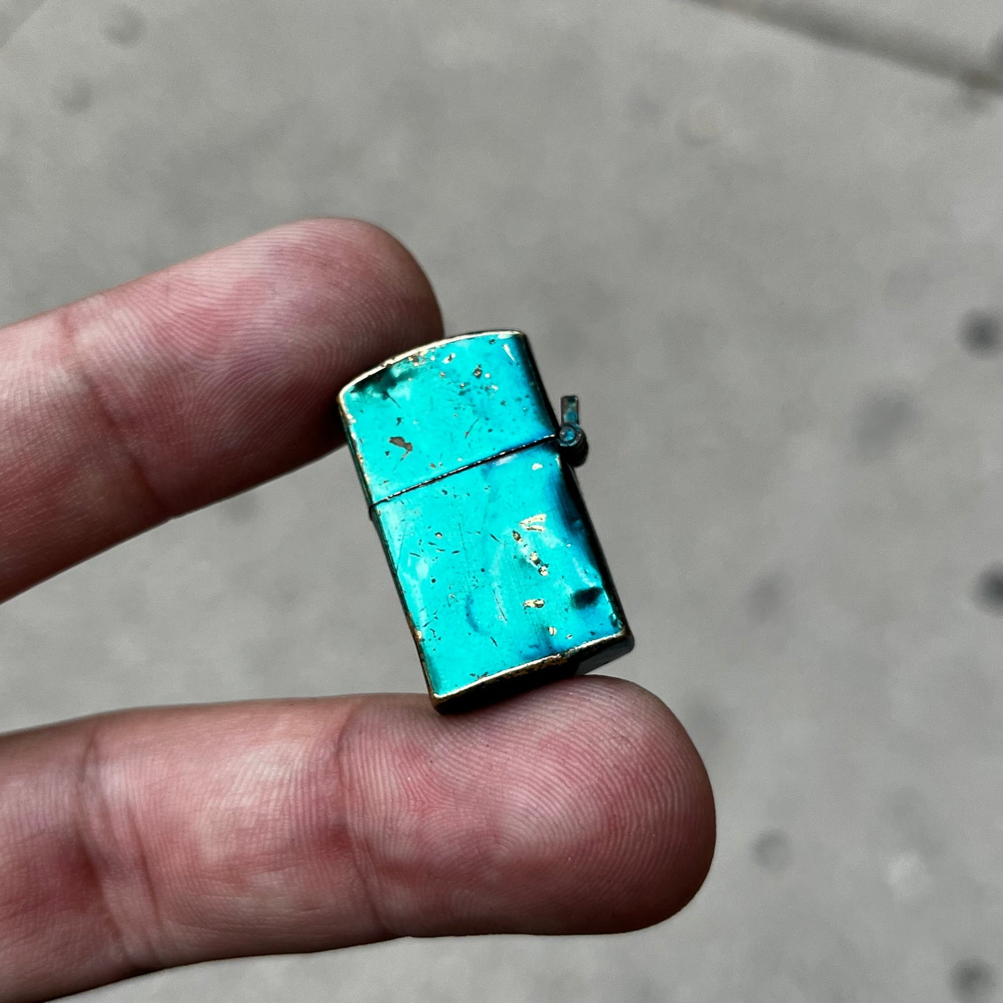 Mini 1960s flip lighter.