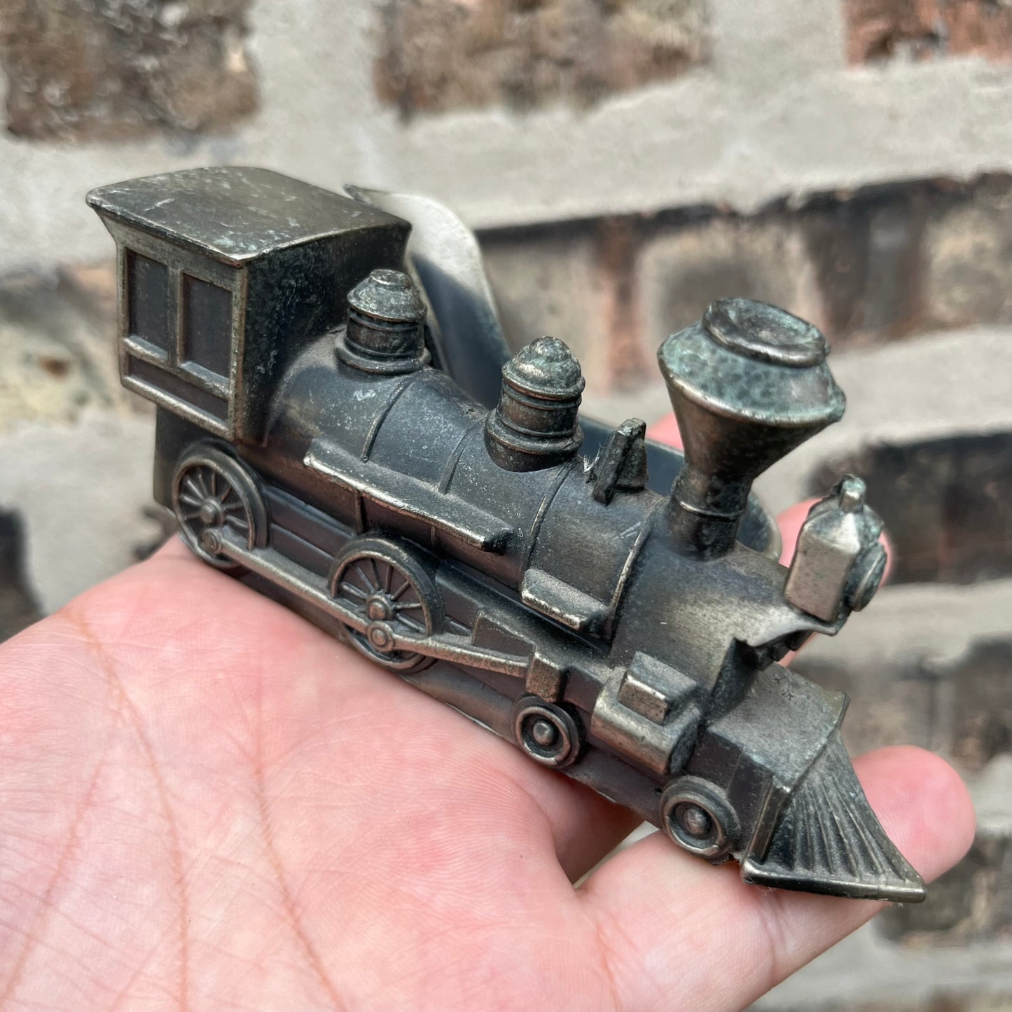 Vintage pewter train pipe holder.