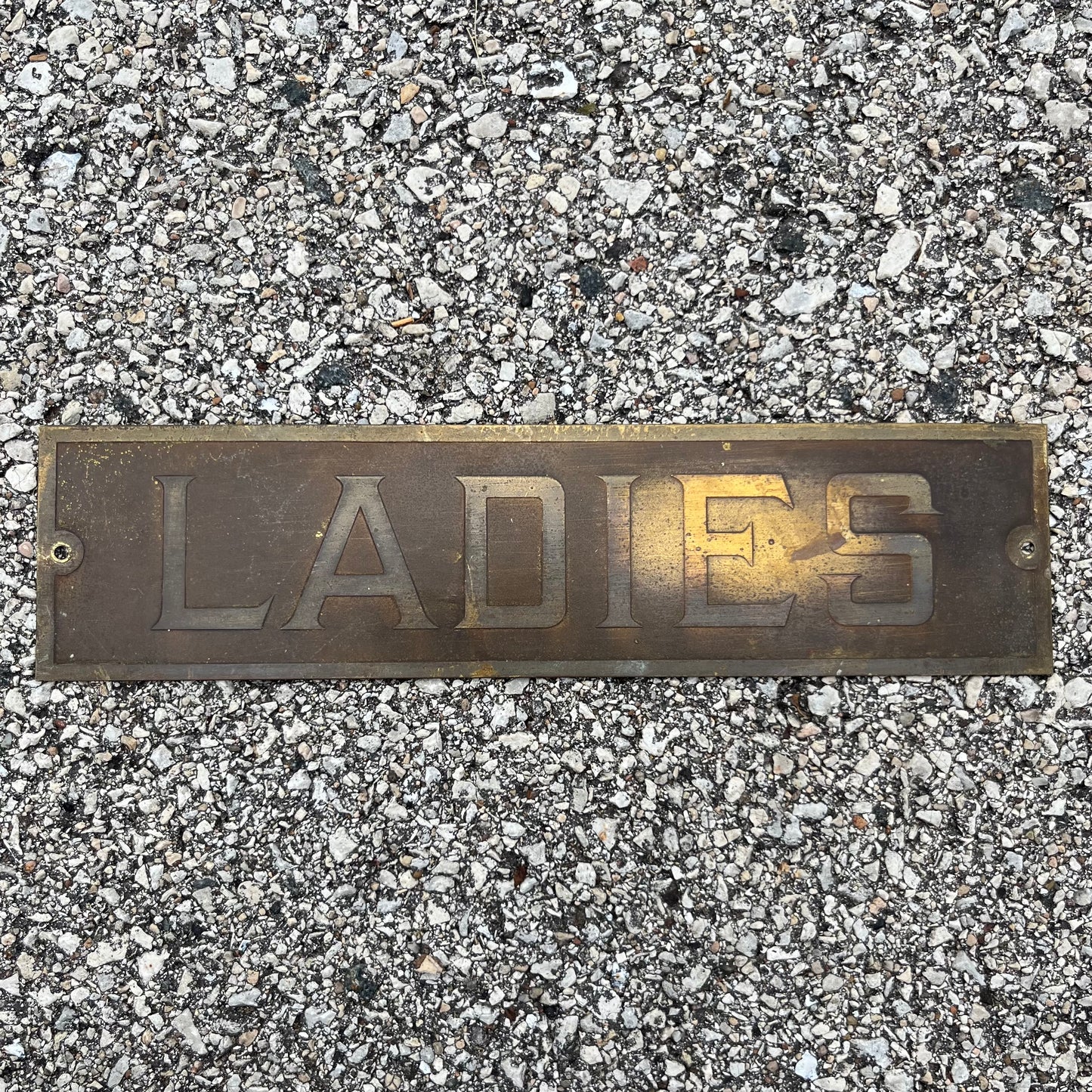 1950s “Ladies” bathroom sign.