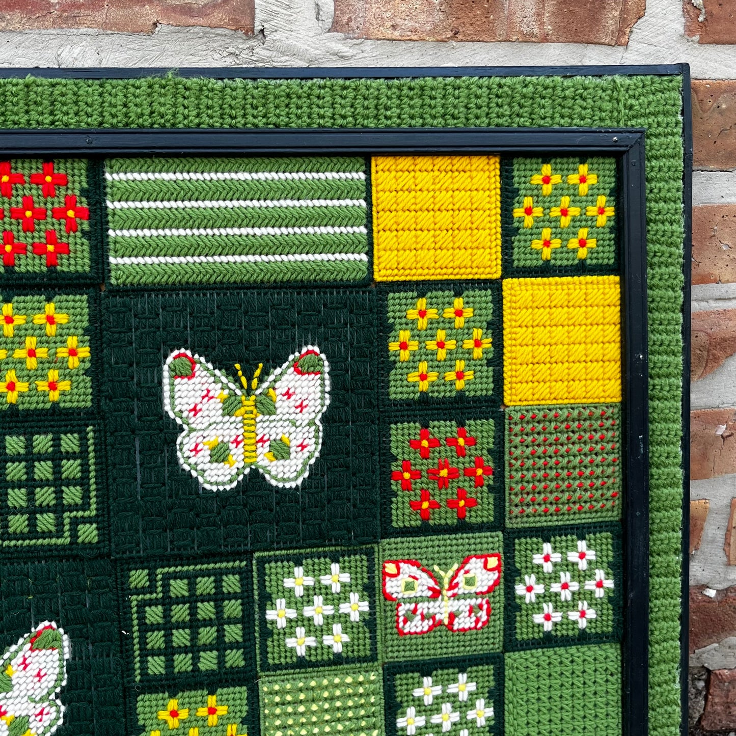 Framed 1970s Buttetfly needlepoint.