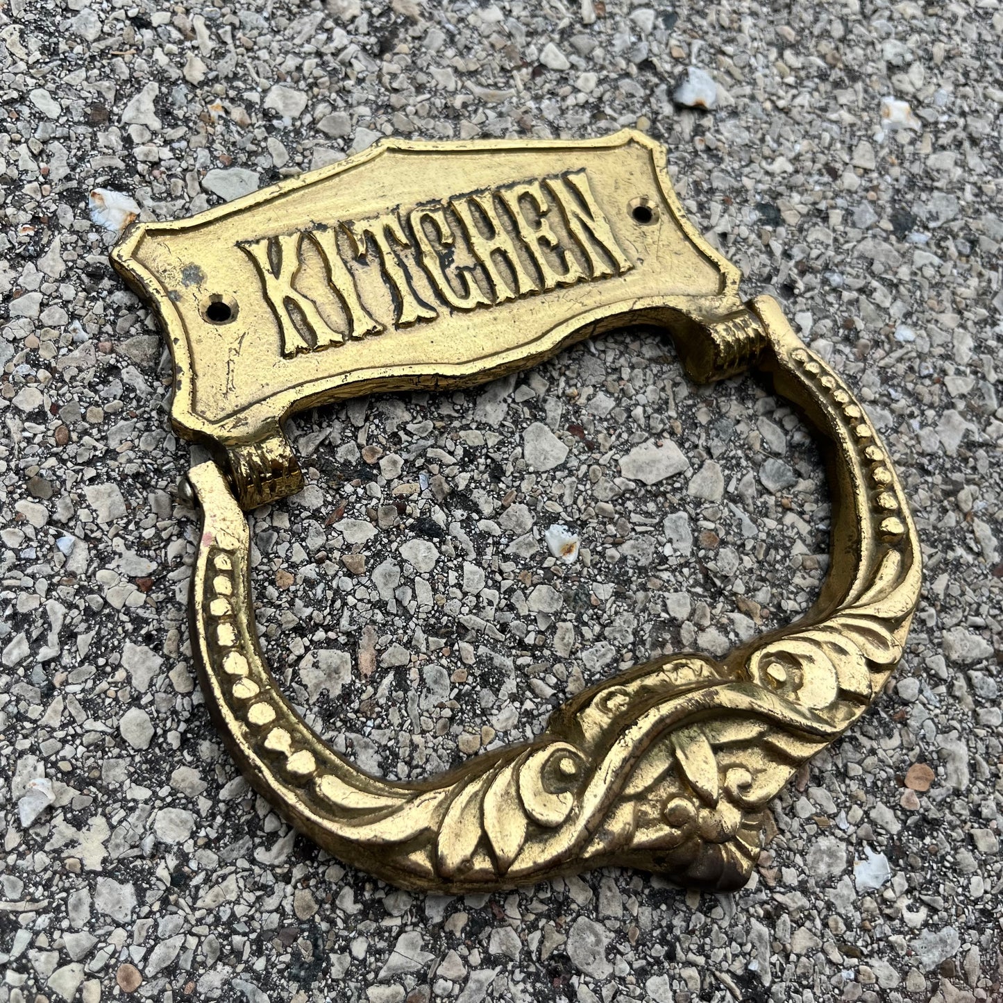 Vintage brass kitchen door knocker.