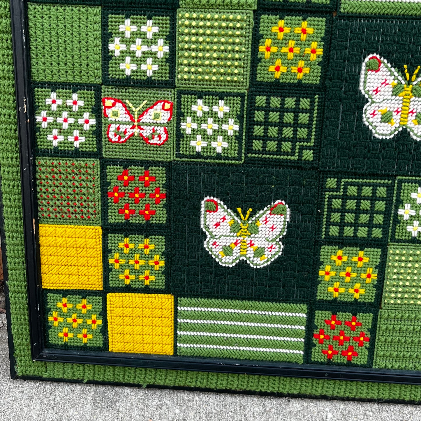 Framed 1970s Buttetfly needlepoint.