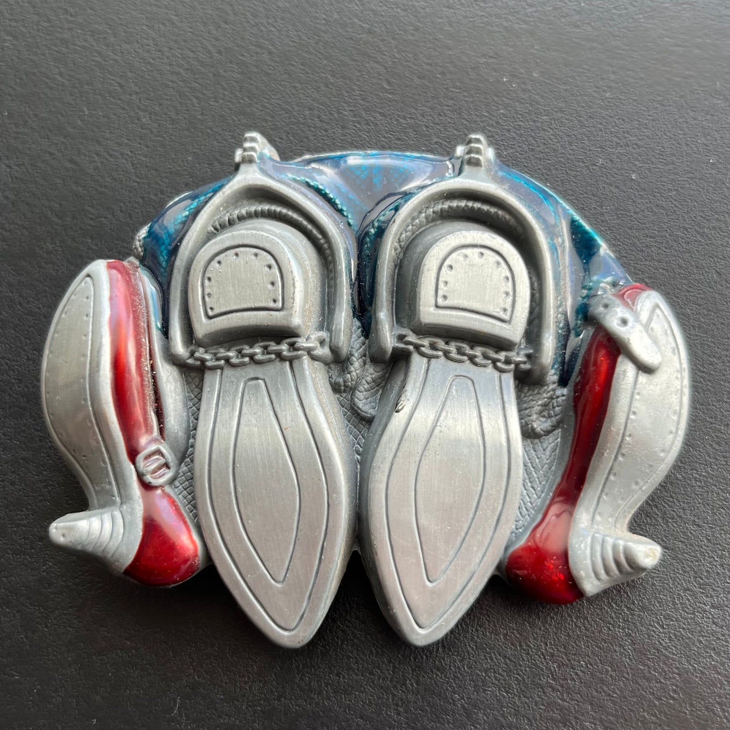 Vintage knocking boots belt buckle.