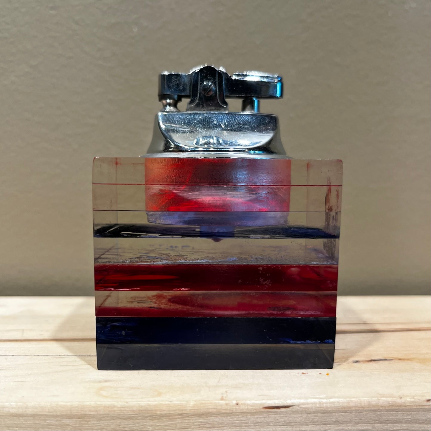 Vintage resin cube lighter.