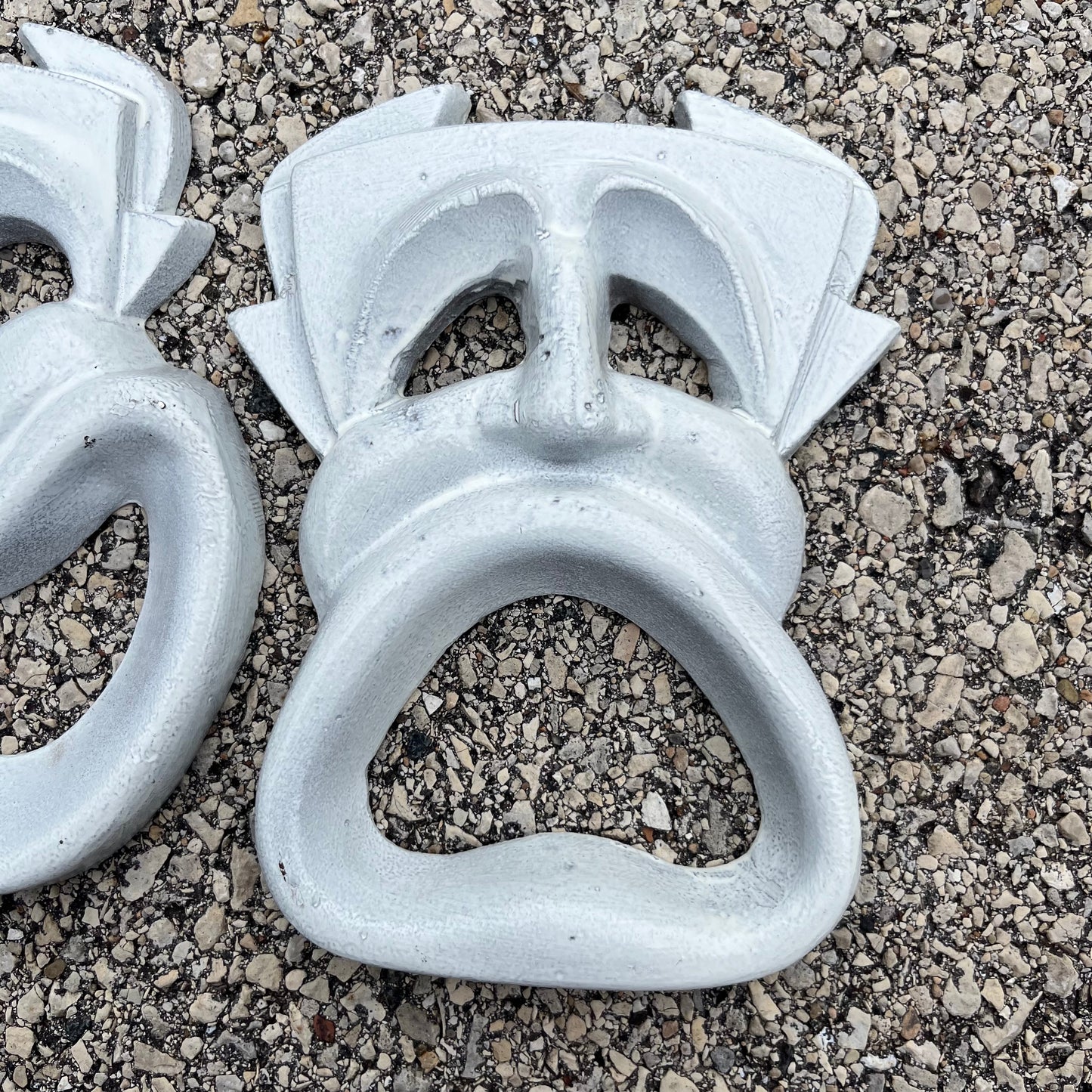 Vintage cast iron drama masks.