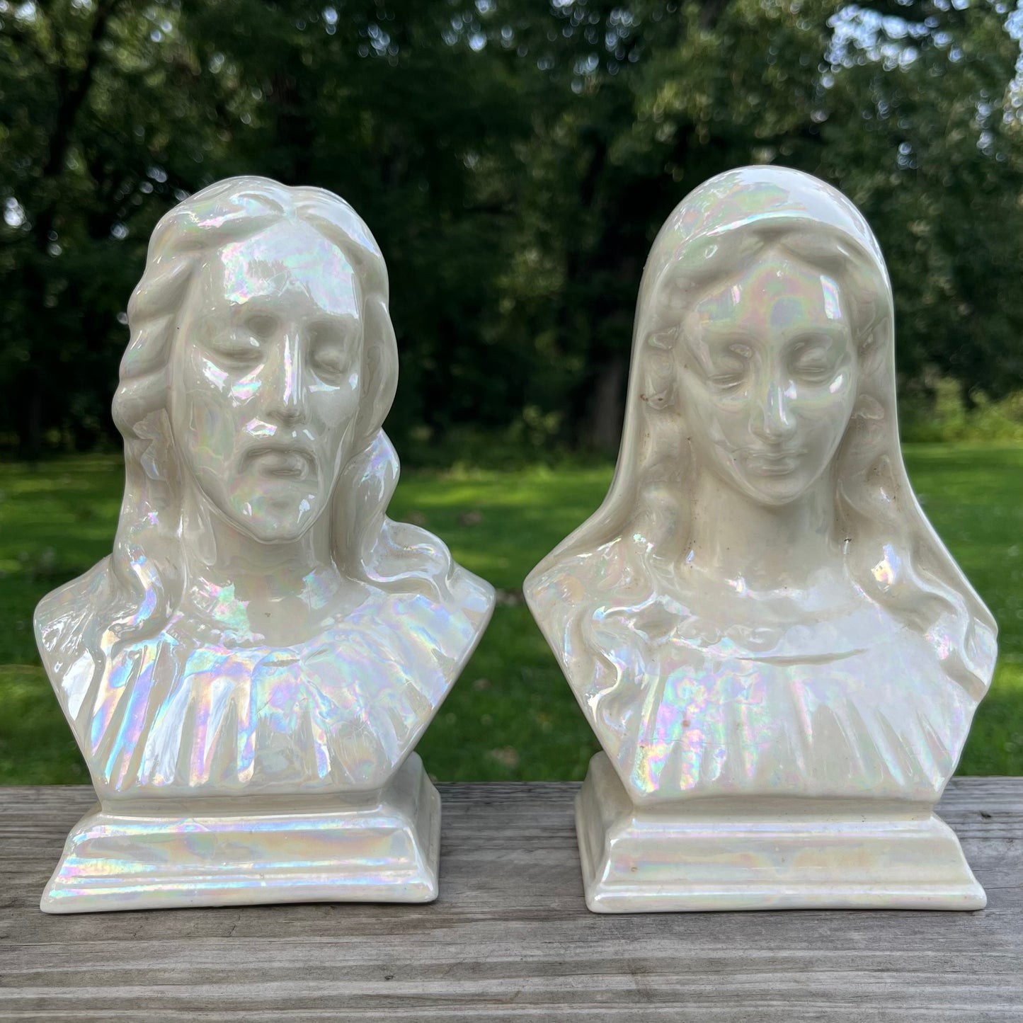 Vintage iridescent Christ and Mary busts.
