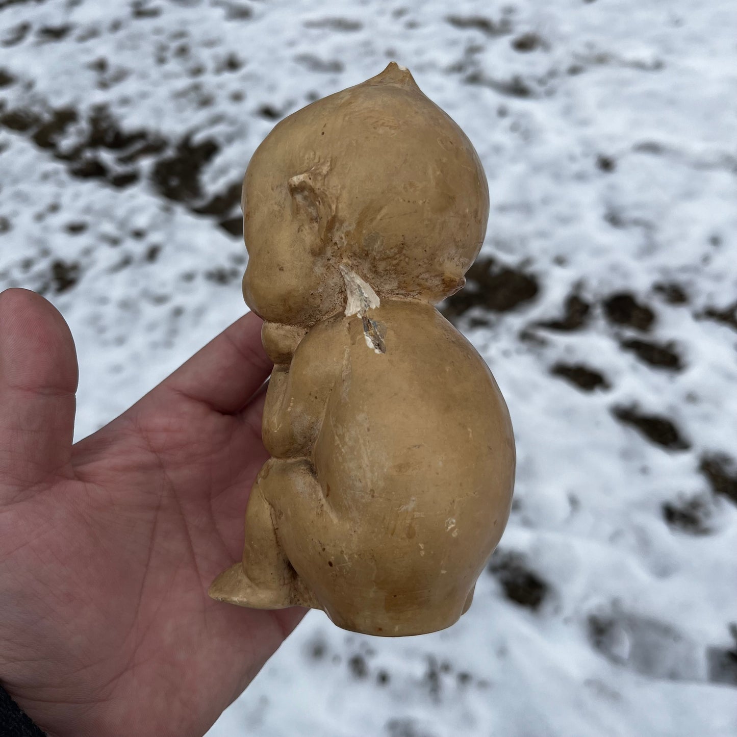 Antique sitting chalkware Kewpie from 1913.