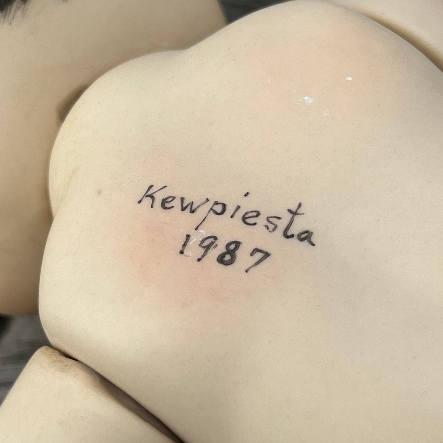 1987 Porcelain Kewpie.