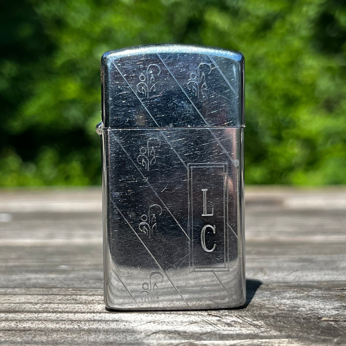 Vintage initial Zippo flip lighter.