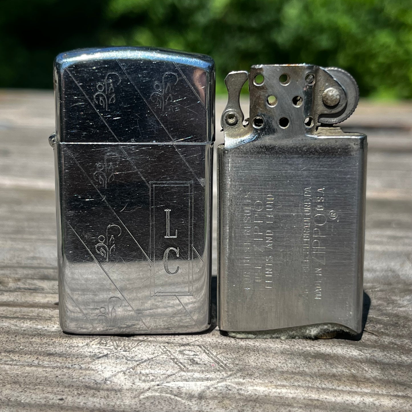 Vintage initial Zippo flip lighter.