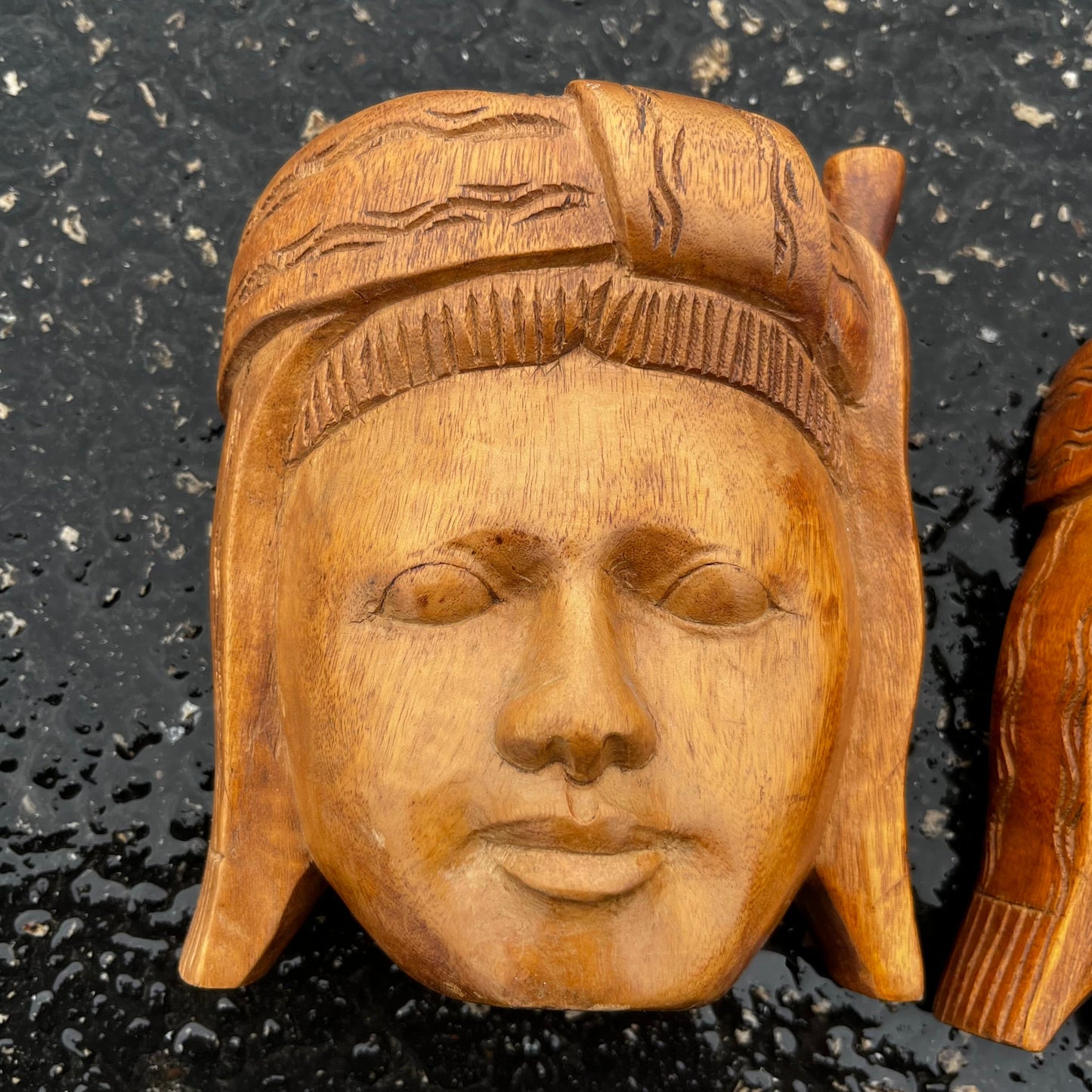 Vintage pair of wooden Ecuadorian masks.