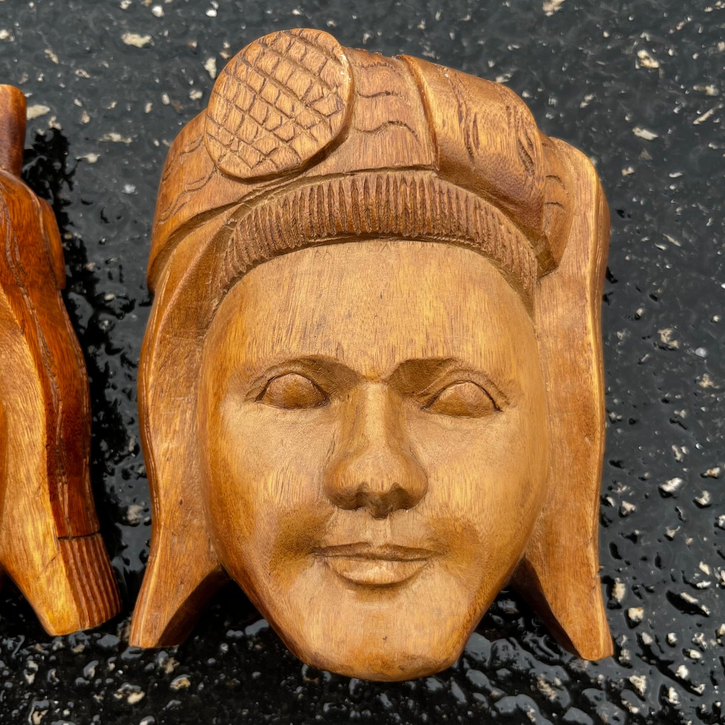 Vintage pair of wooden Ecuadorian masks.