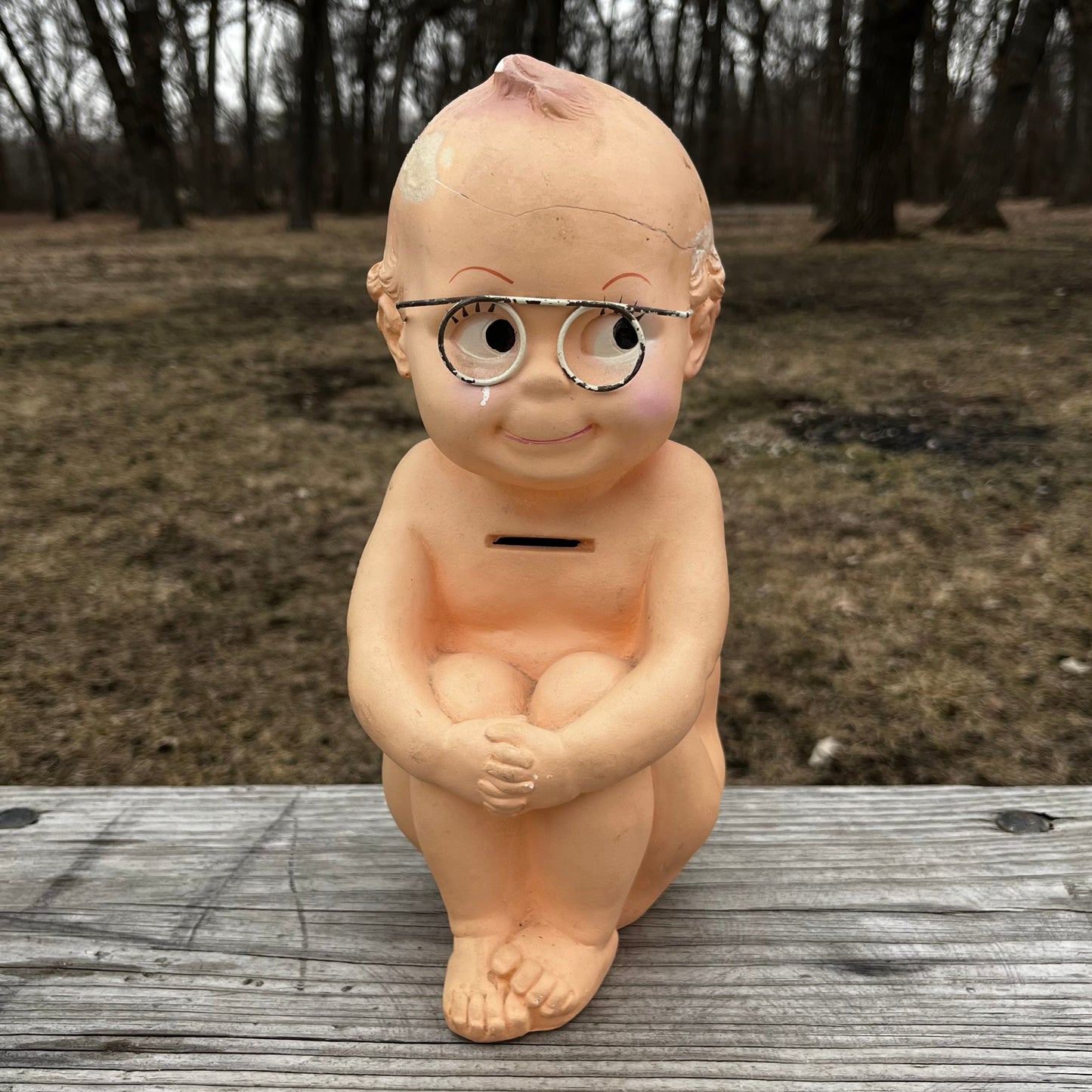 Vintage chalkware Kewpie coin bank. (Repaired)