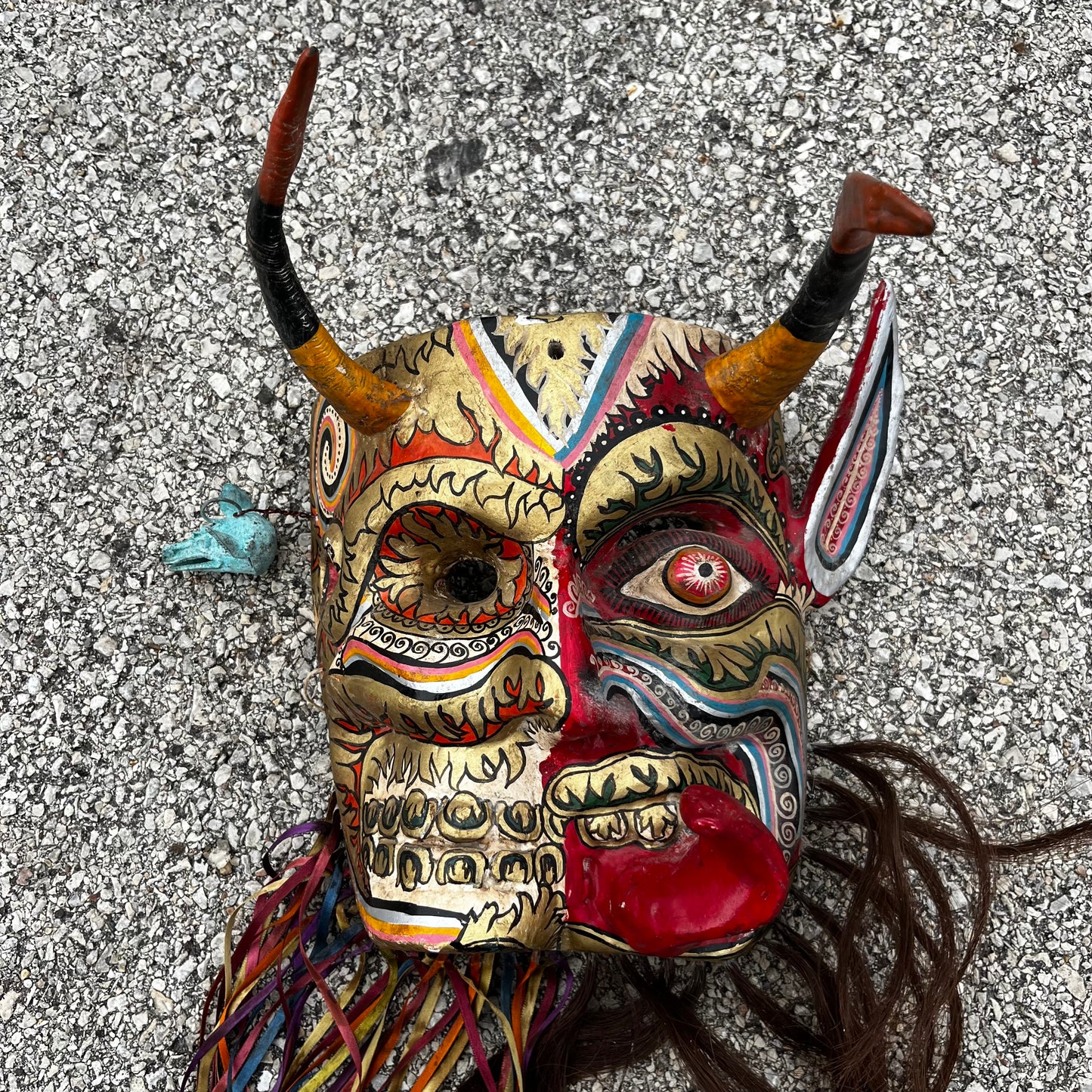 Split personality day of the dead Diablo mask.
