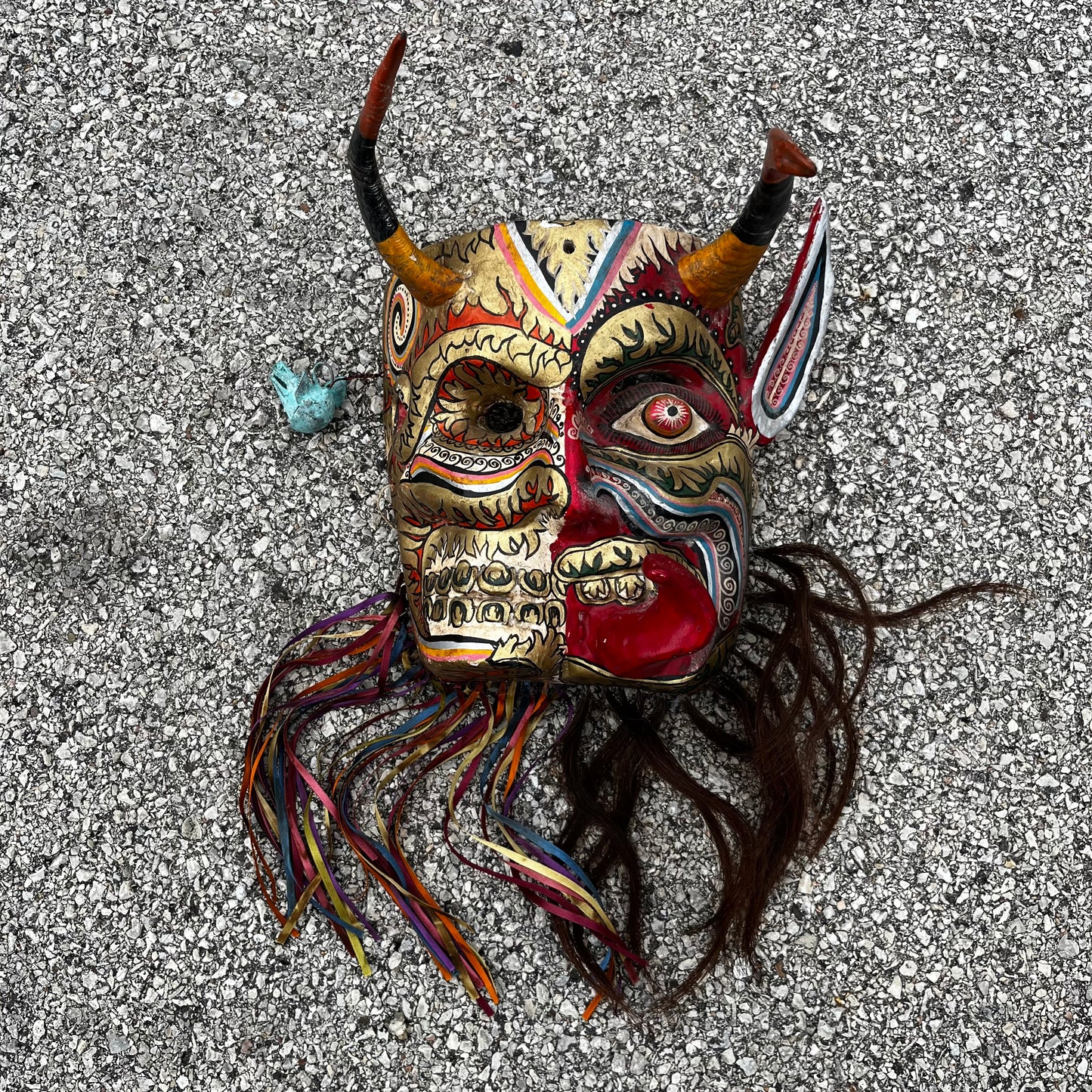 Split personality day of the dead Diablo mask.