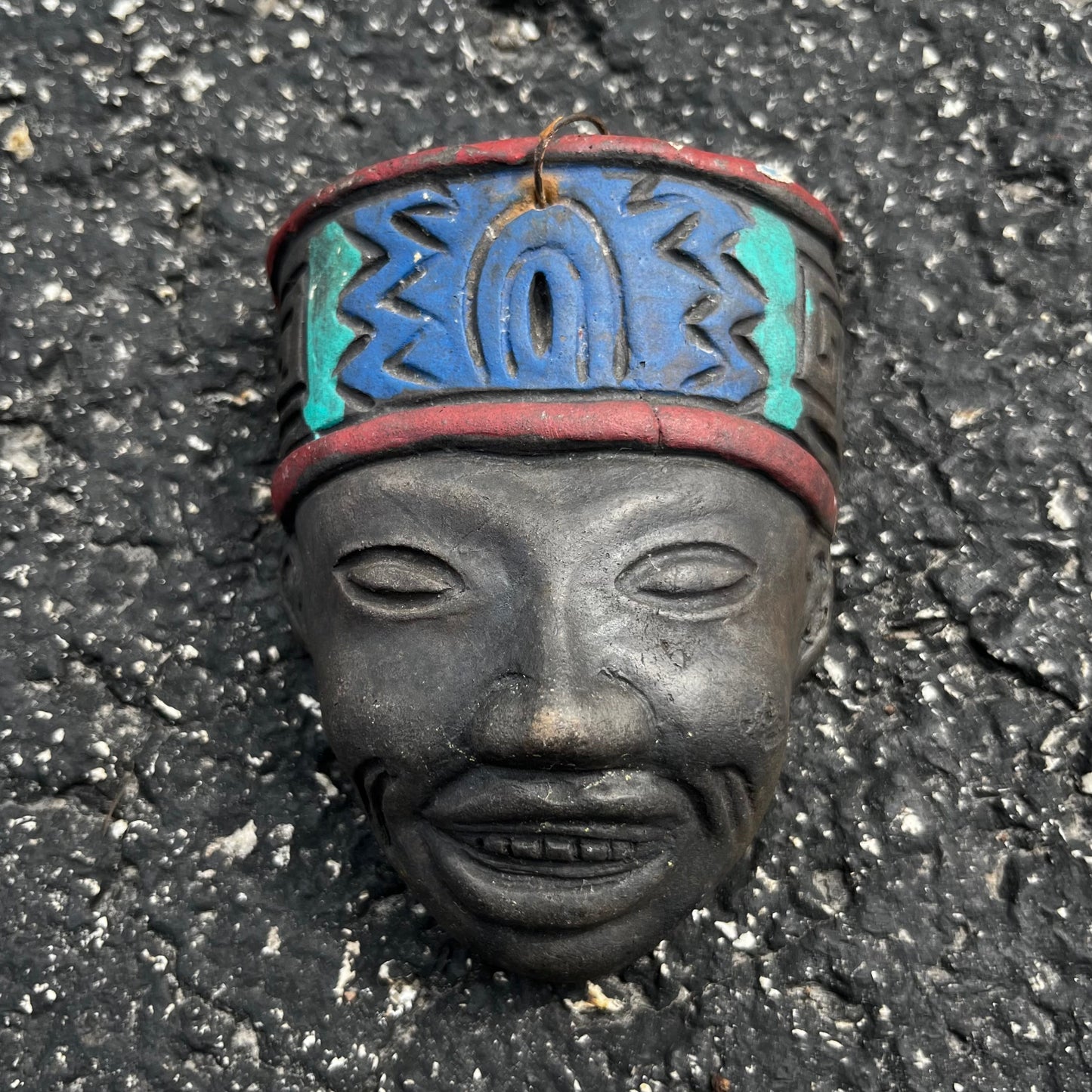 Palm size clay Mexican mask.