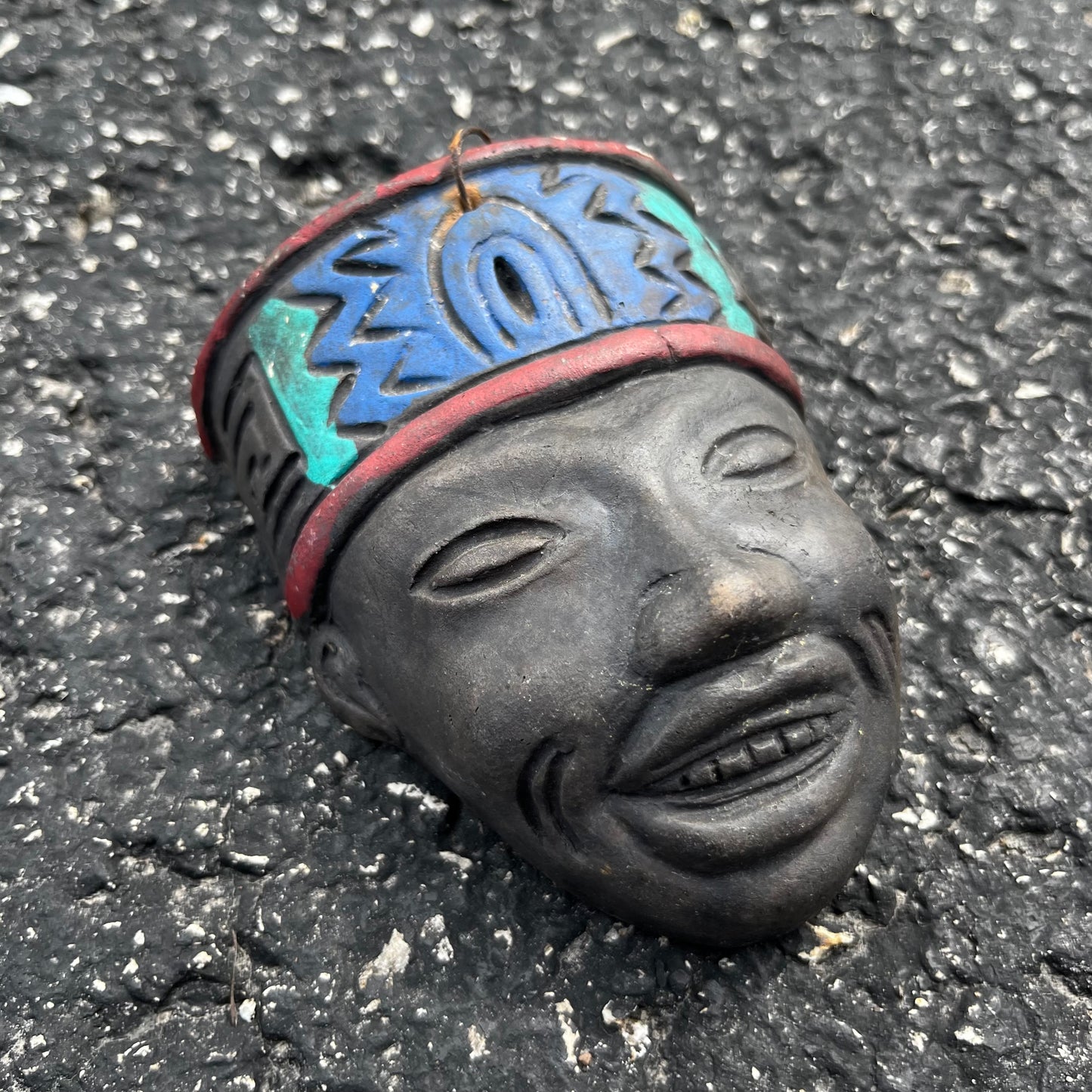 Palm size clay Mexican mask.