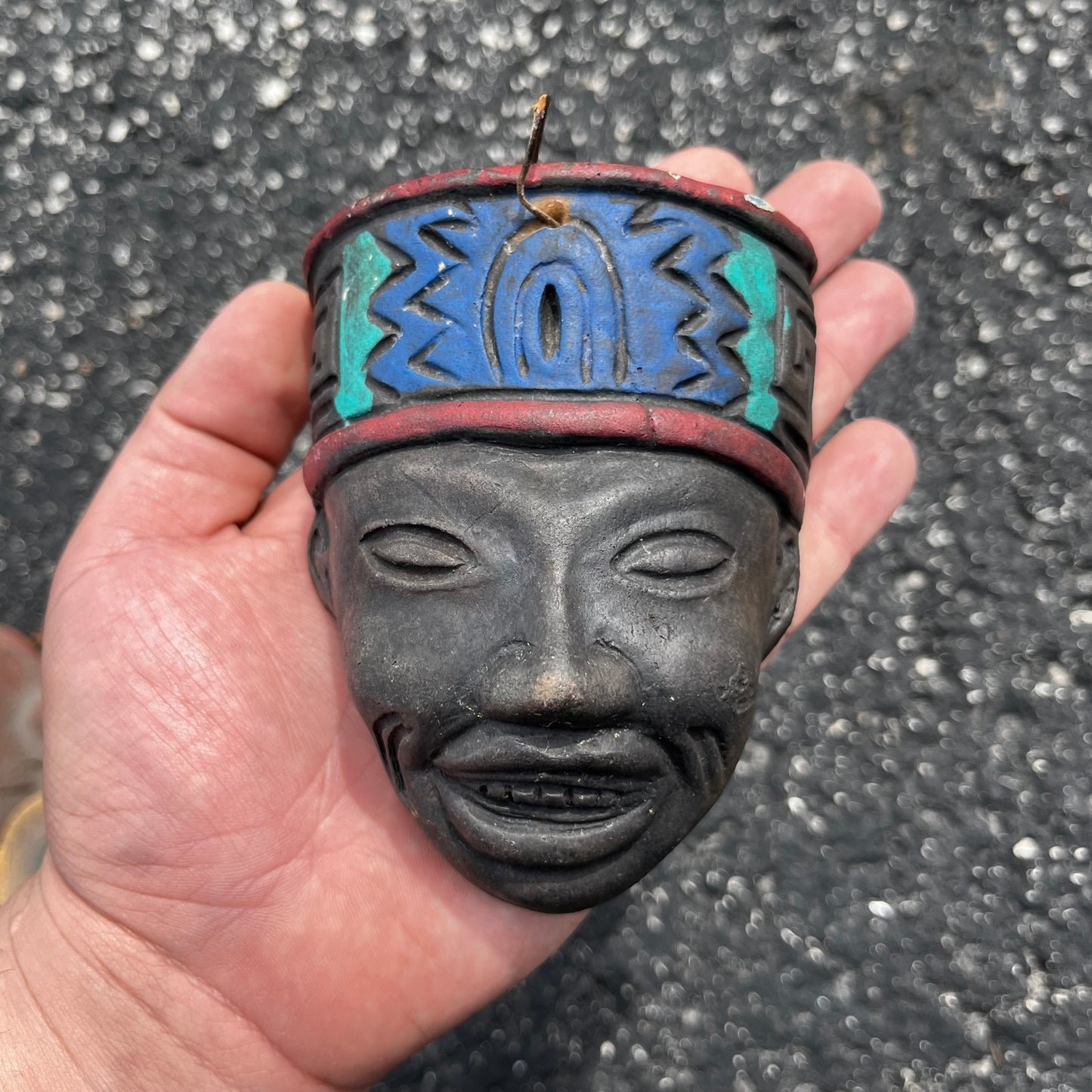Palm size clay Mexican mask.