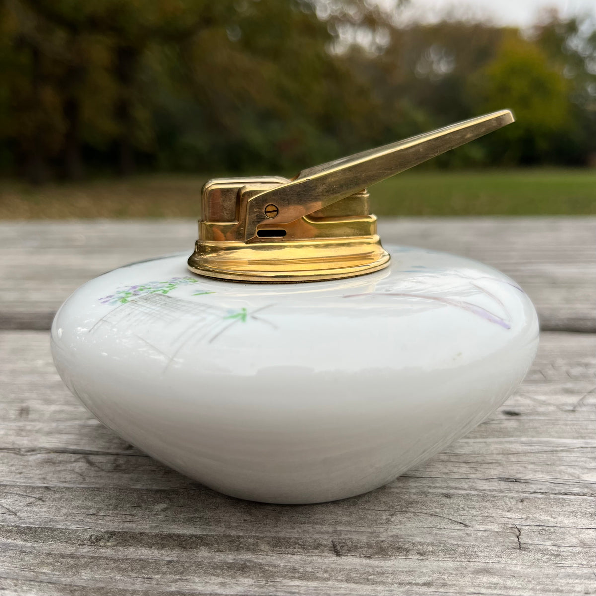Vintage ceramic tabletop lighter.