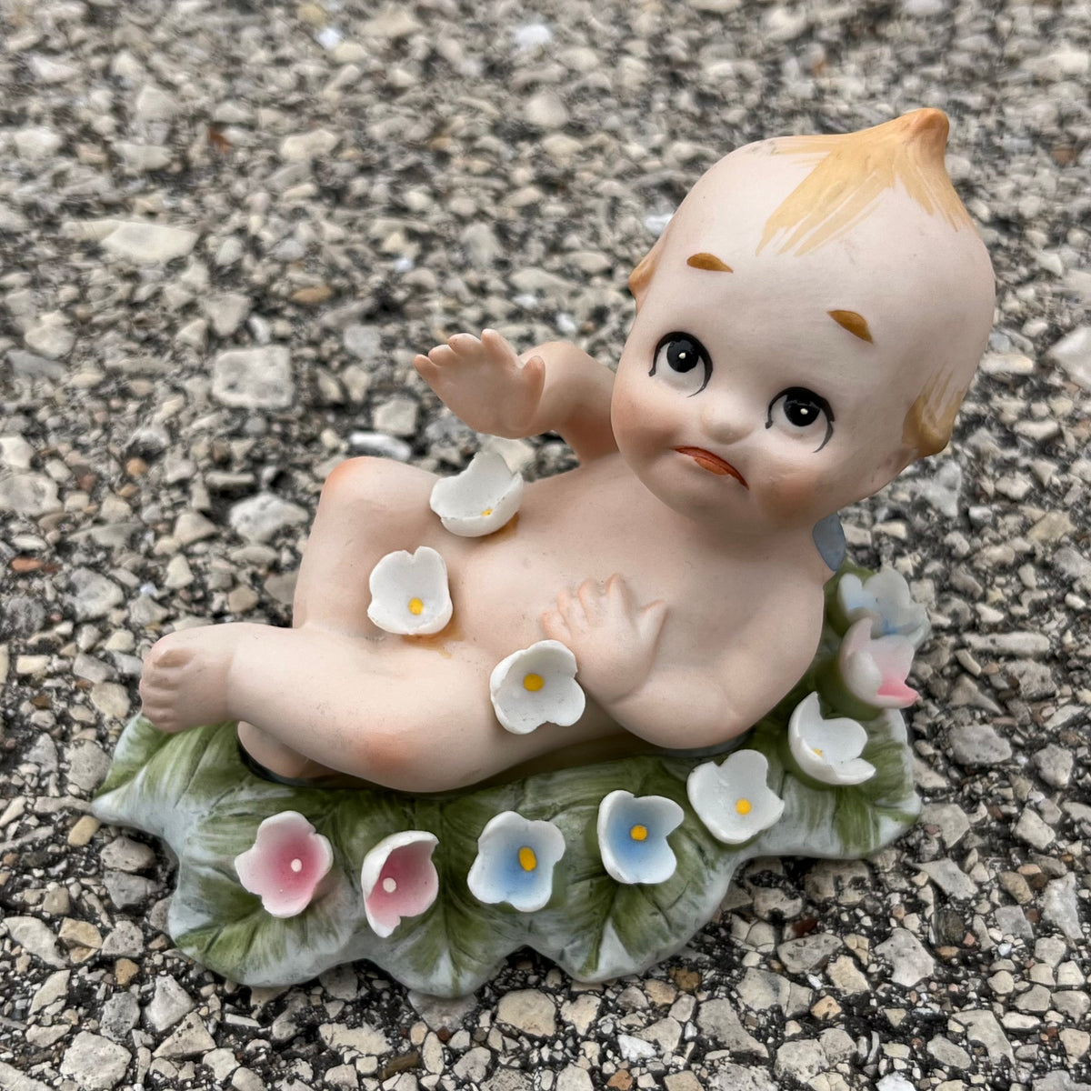 Vintage bisque flower bed Kewpie.