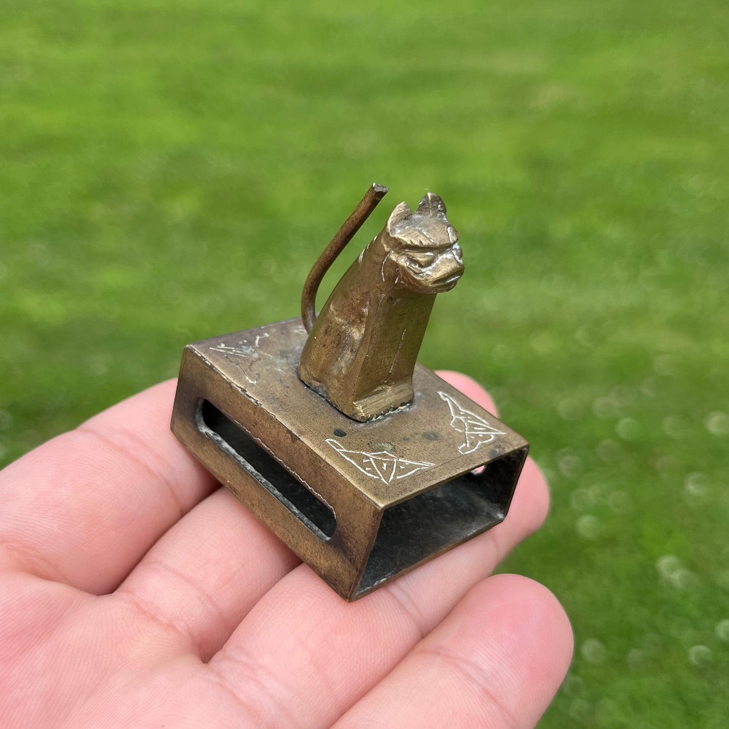 Vintage brass cat matchbook safe.