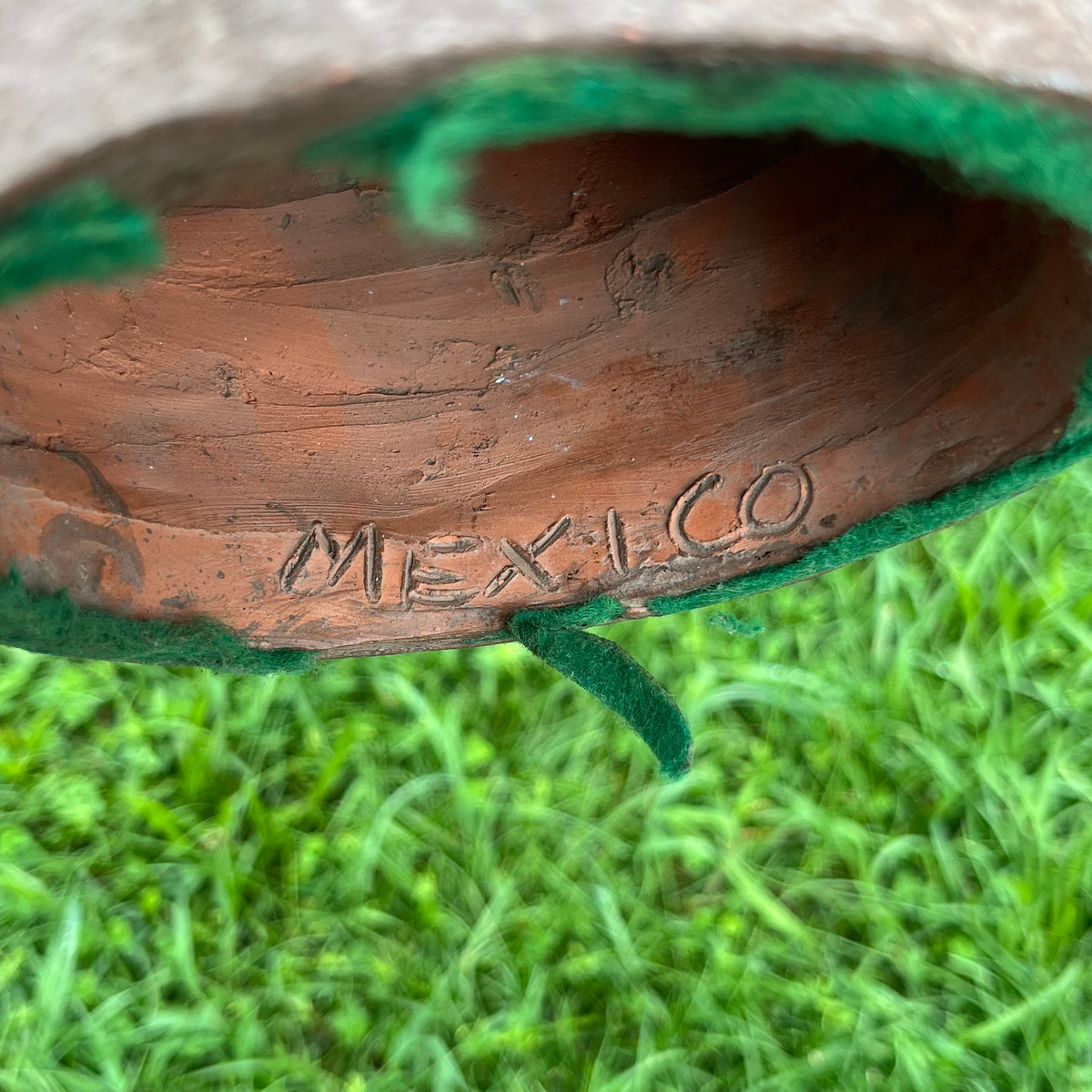 Vintage clay souvenir Olmec mask.