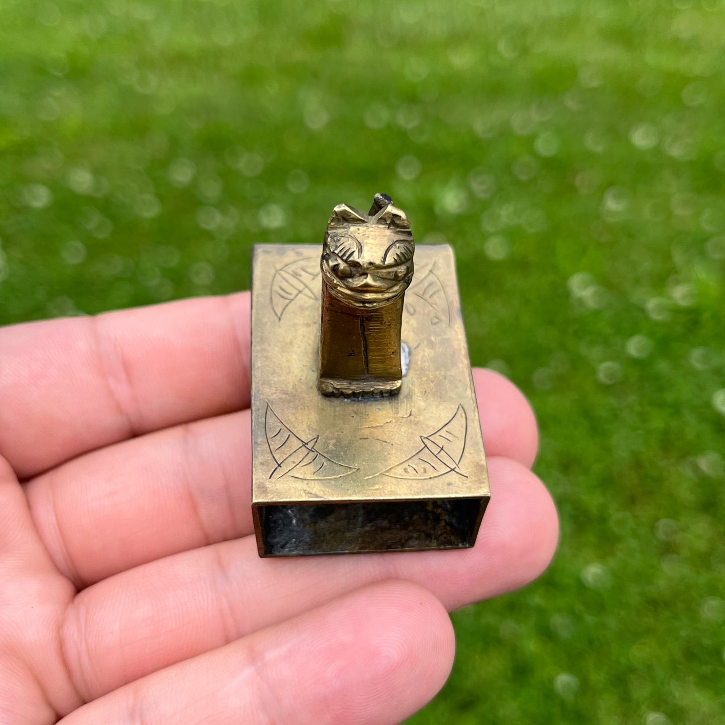 Vintage brass cat matchbook safe.