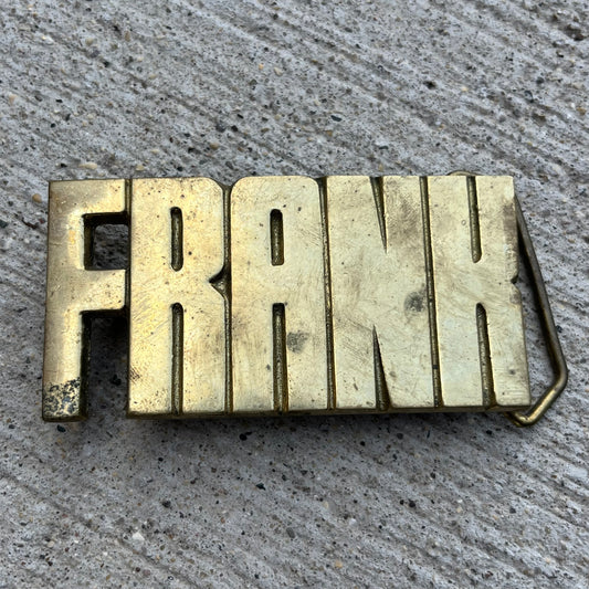 1978 Brass “Frank” belt buckle.