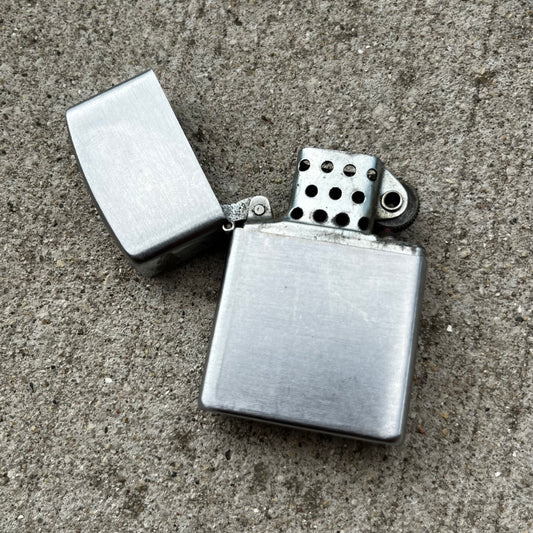 Vintage Golden Bell flip lighter.