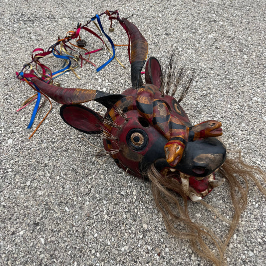 Vintage decorative reindeer snake mask.