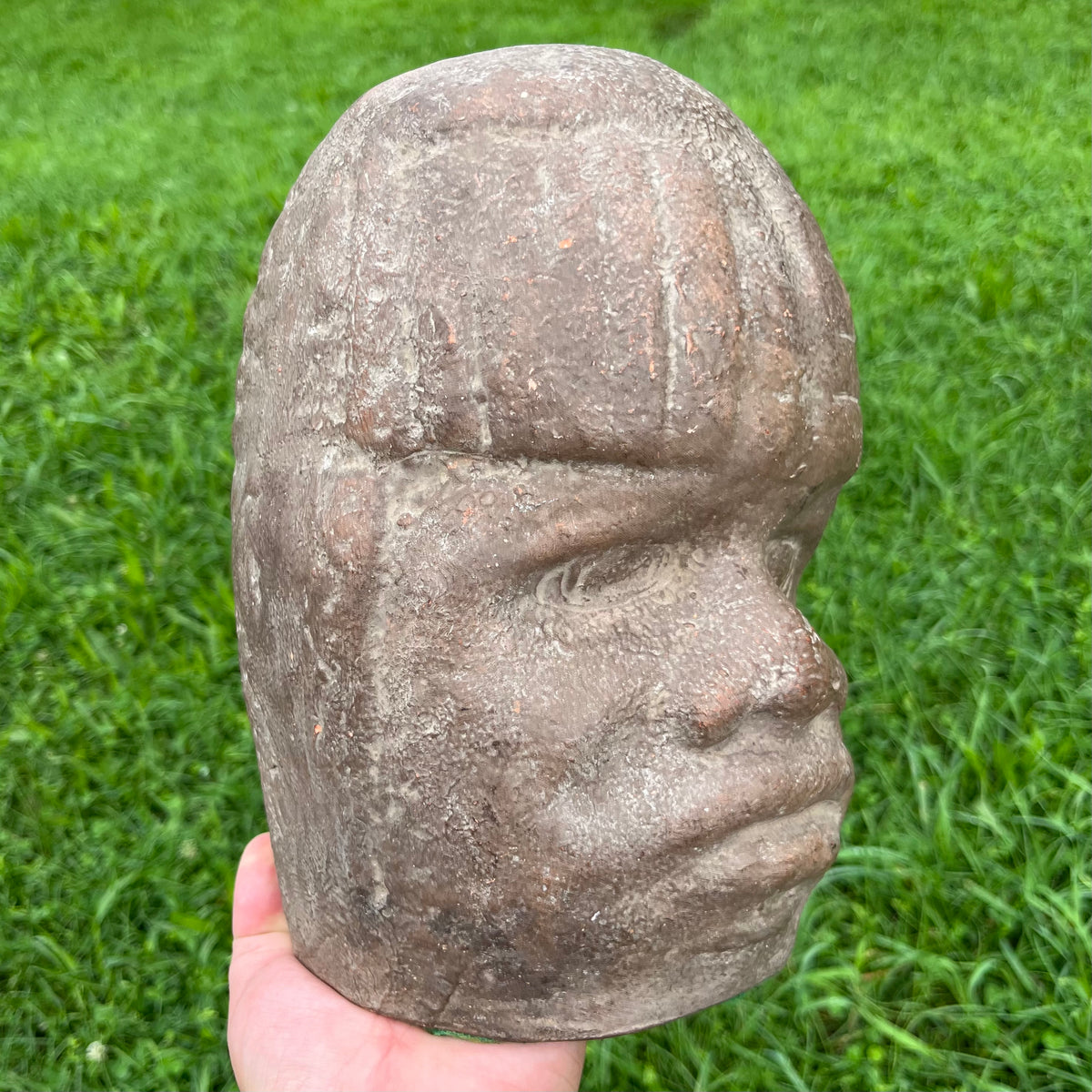 Vintage clay souvenir Olmec mask.