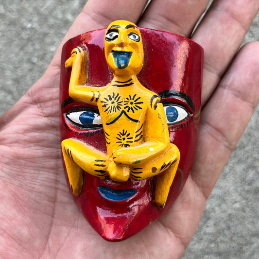 Vintage naughty yellow man mask.
