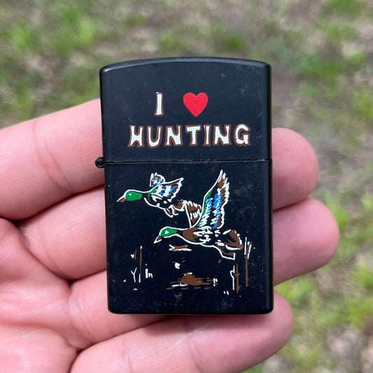 90s “I Love Hunting” flip lighter.