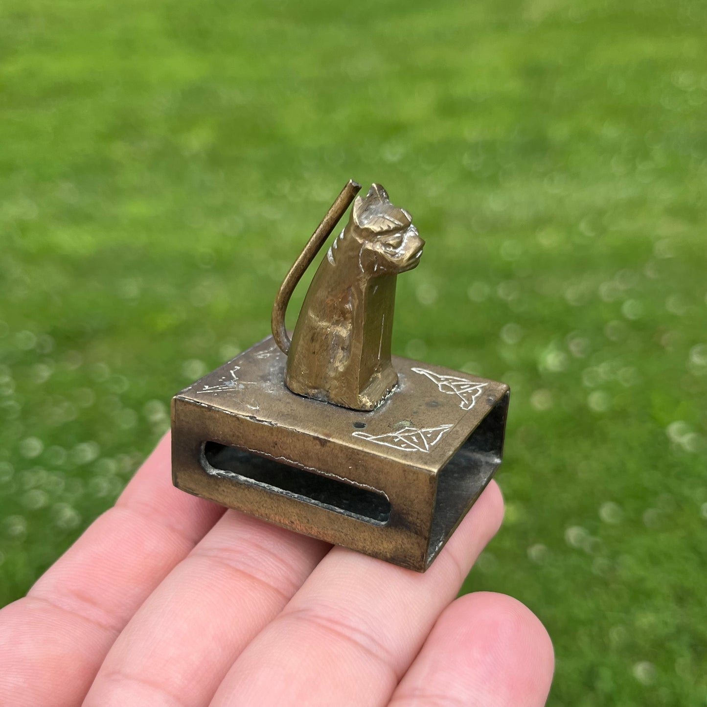 Vintage brass cat matchbook safe.
